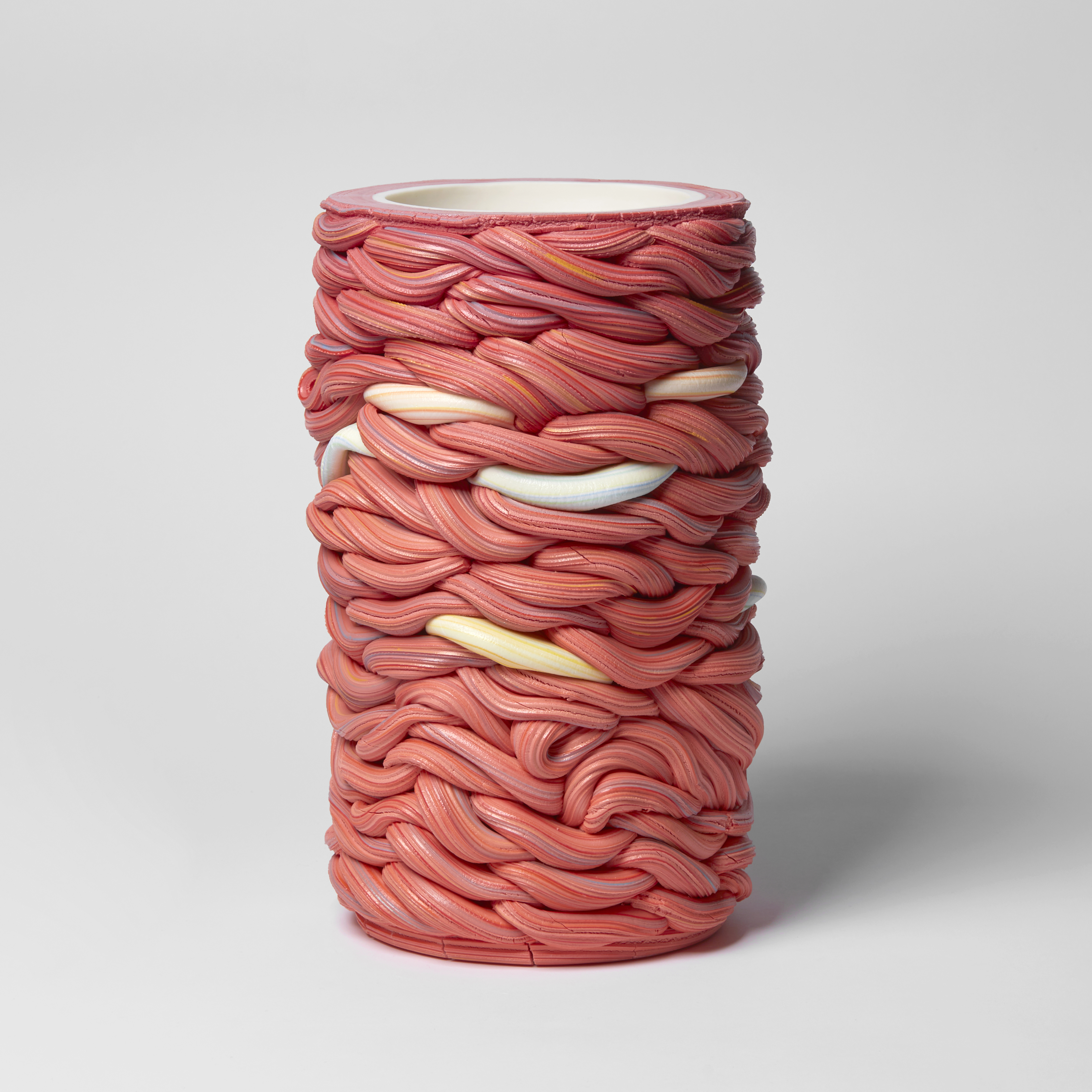 red and mixed colours interwoven cylinder vessel handmade from parian porcelain