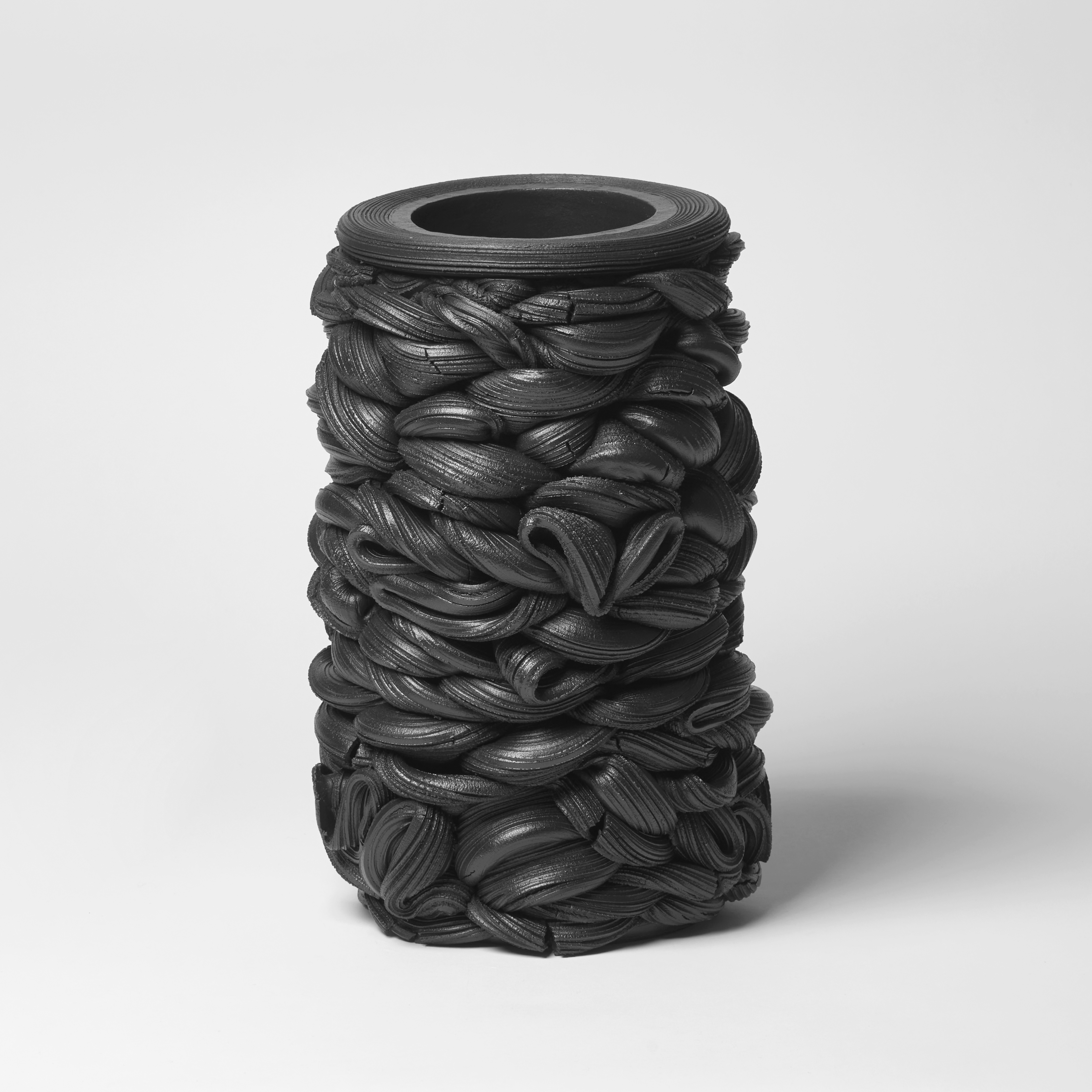 black liquorice stacked interwoven vessel handmade from clay 