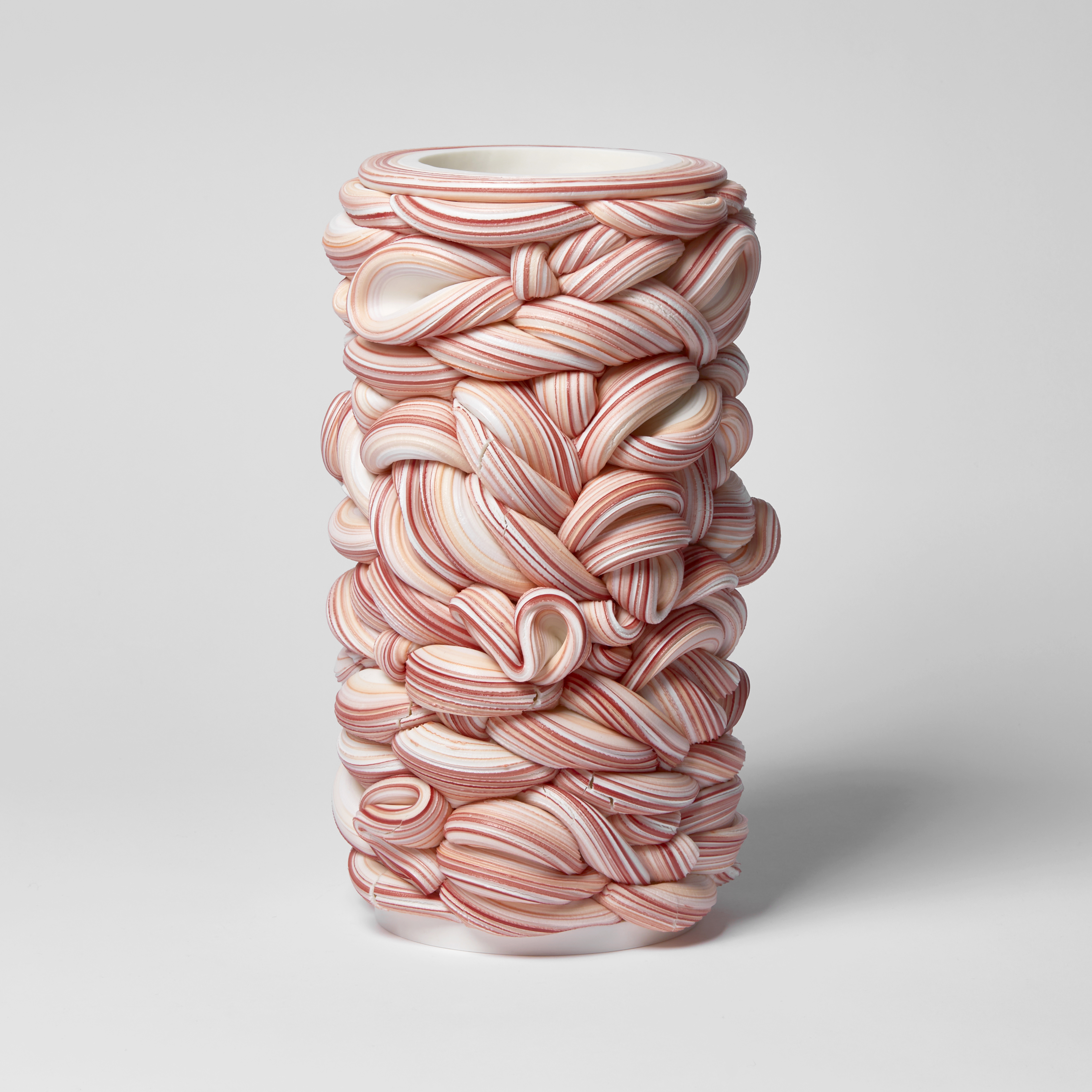 striped red orange violet and white woven candy vessel handmade from clay 