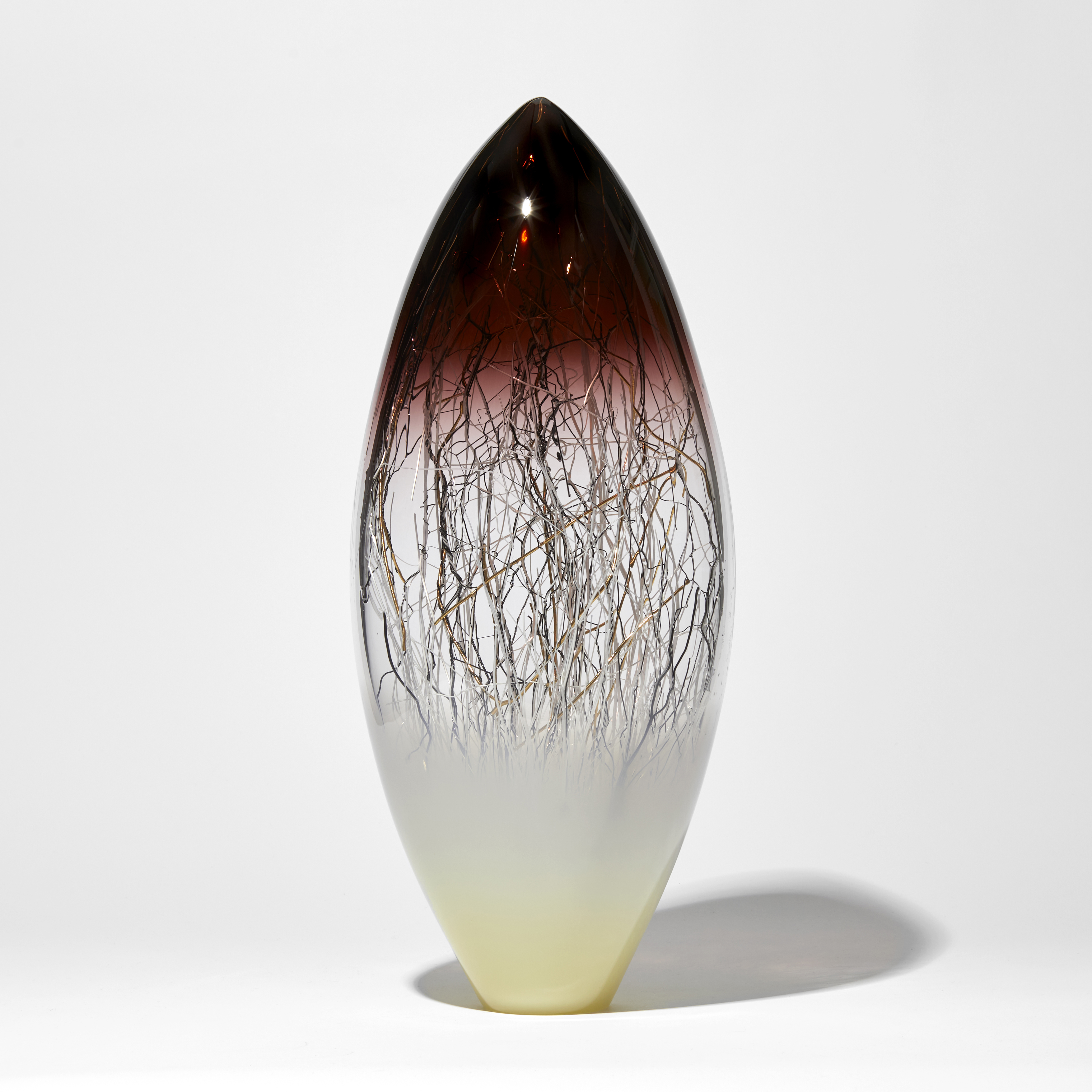 tall cream deep aubergine amber and clear ovoid sculpture with internal fine canes in black white and gold handmade from glass