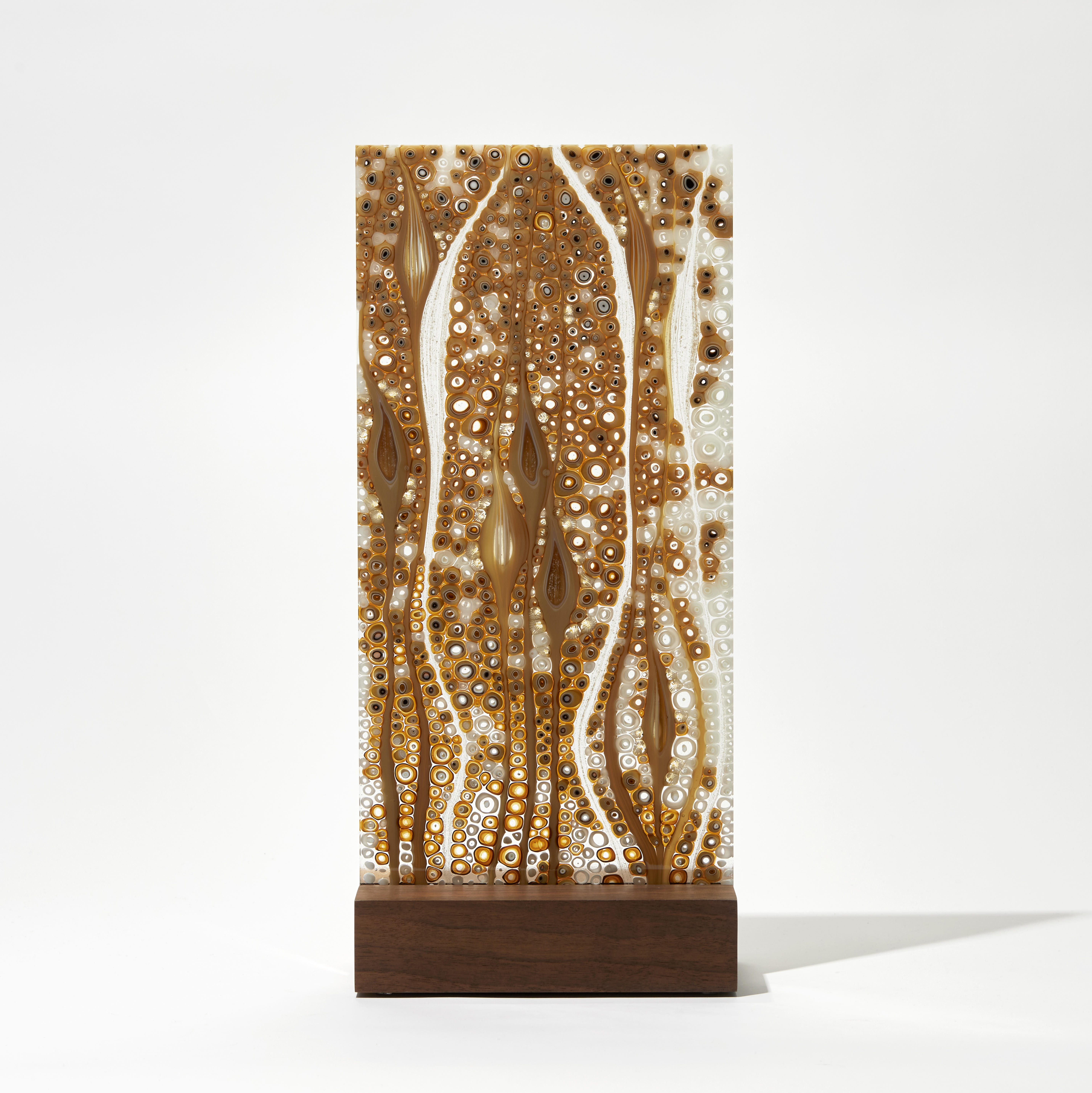 gold and brown panel handmade from glass with organic pattern and wooden base