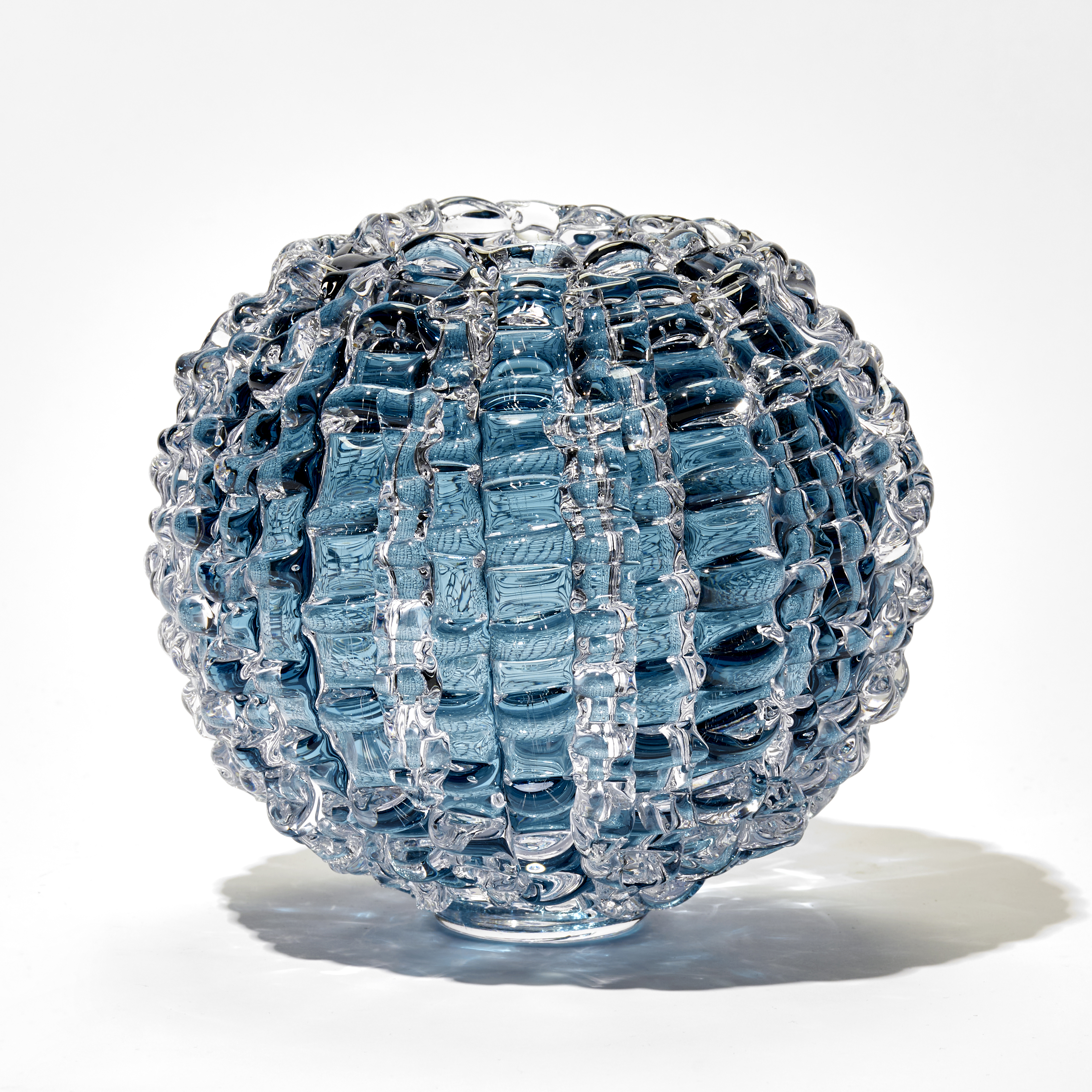 aqua blue echinus inspired round hand blown glass vase with rippled surface