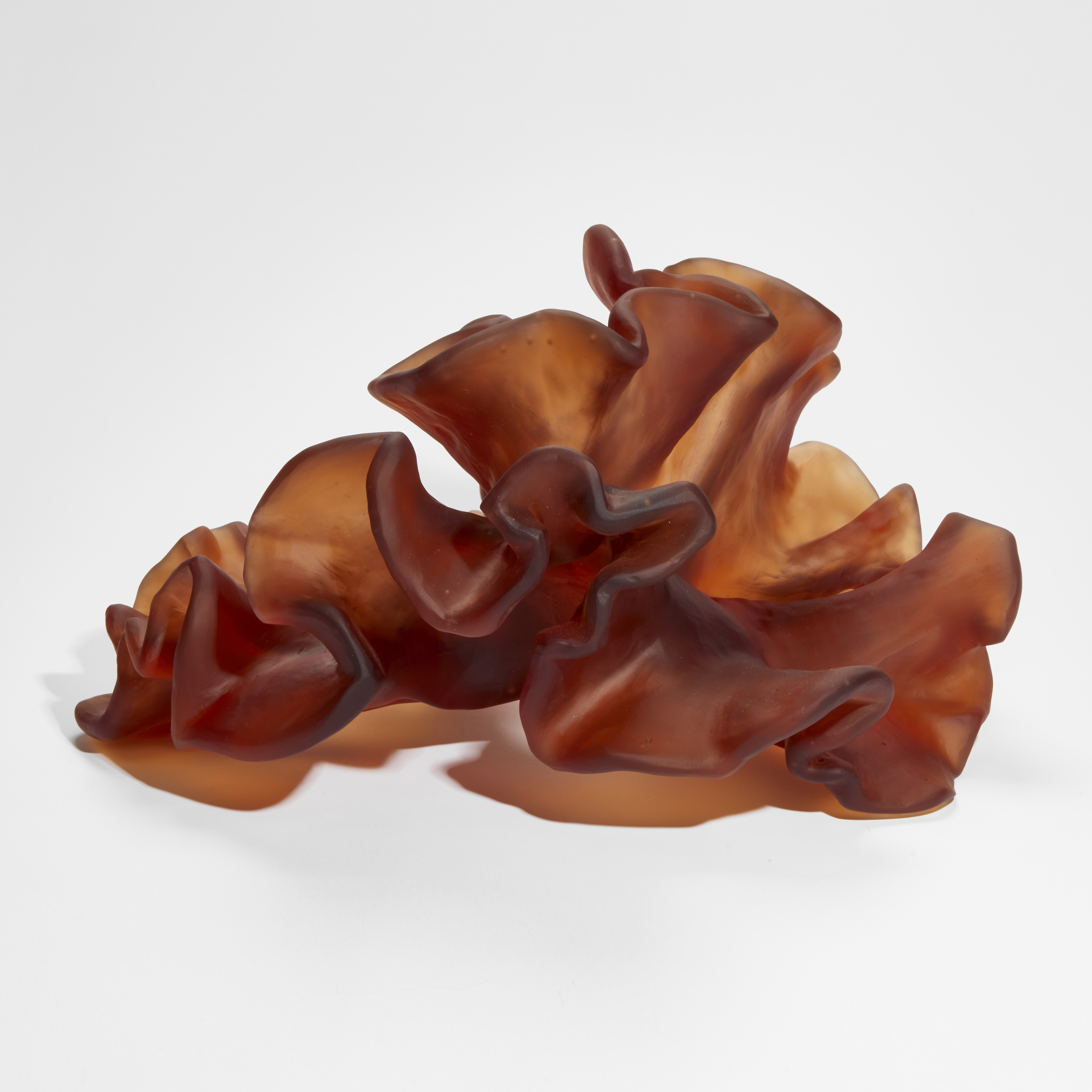 burnt orange amber organic seaweed like sculpture hand made from cast glass