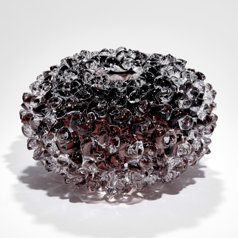 low round soft blob covered vessel hand blown from aubergine brown coloured glass