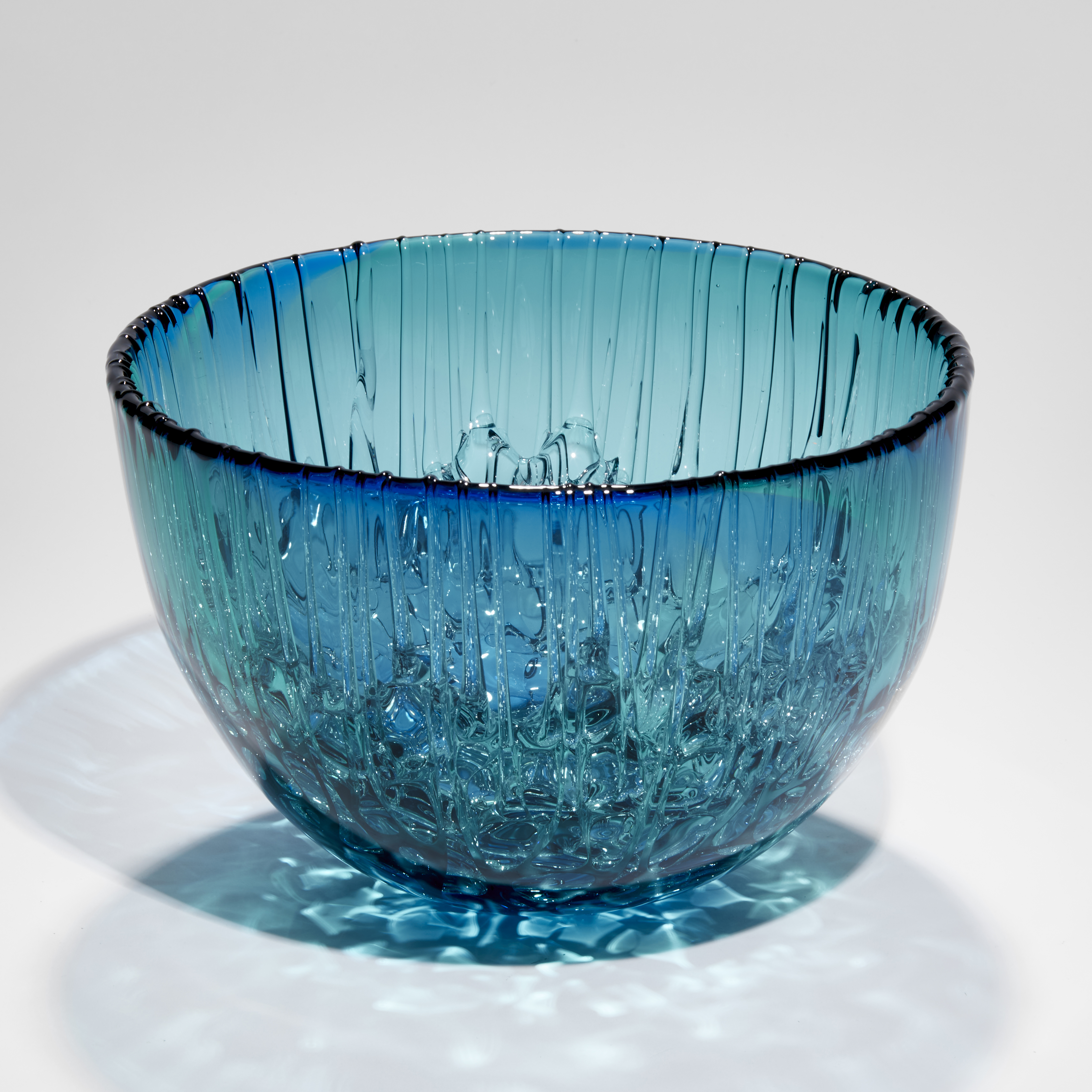 blue and green rounded based bowl with dribbled inside hand made from glass