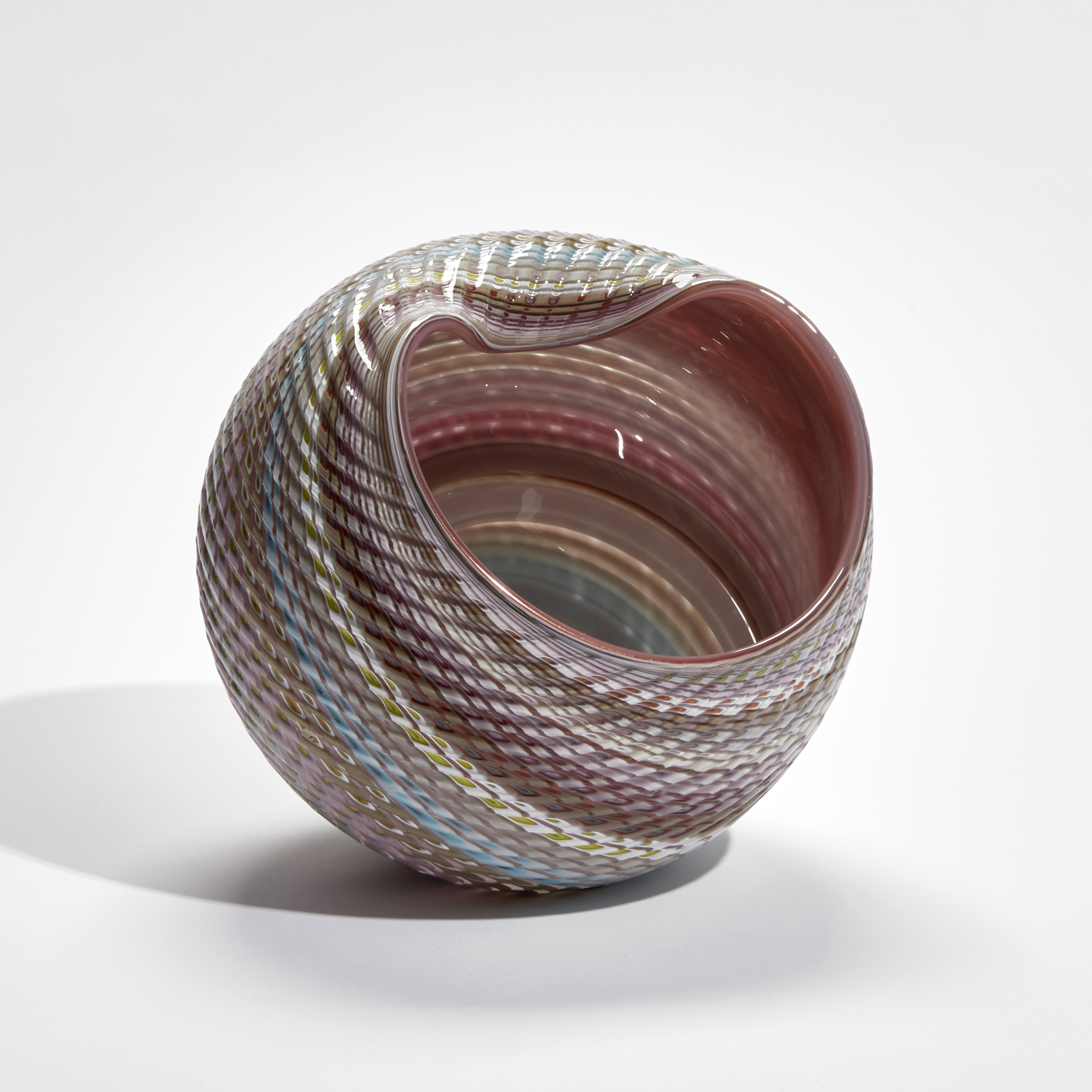 abstract striped pastel coloured shell sculpture with glossy interior and ridged cut exterior handmade from glass