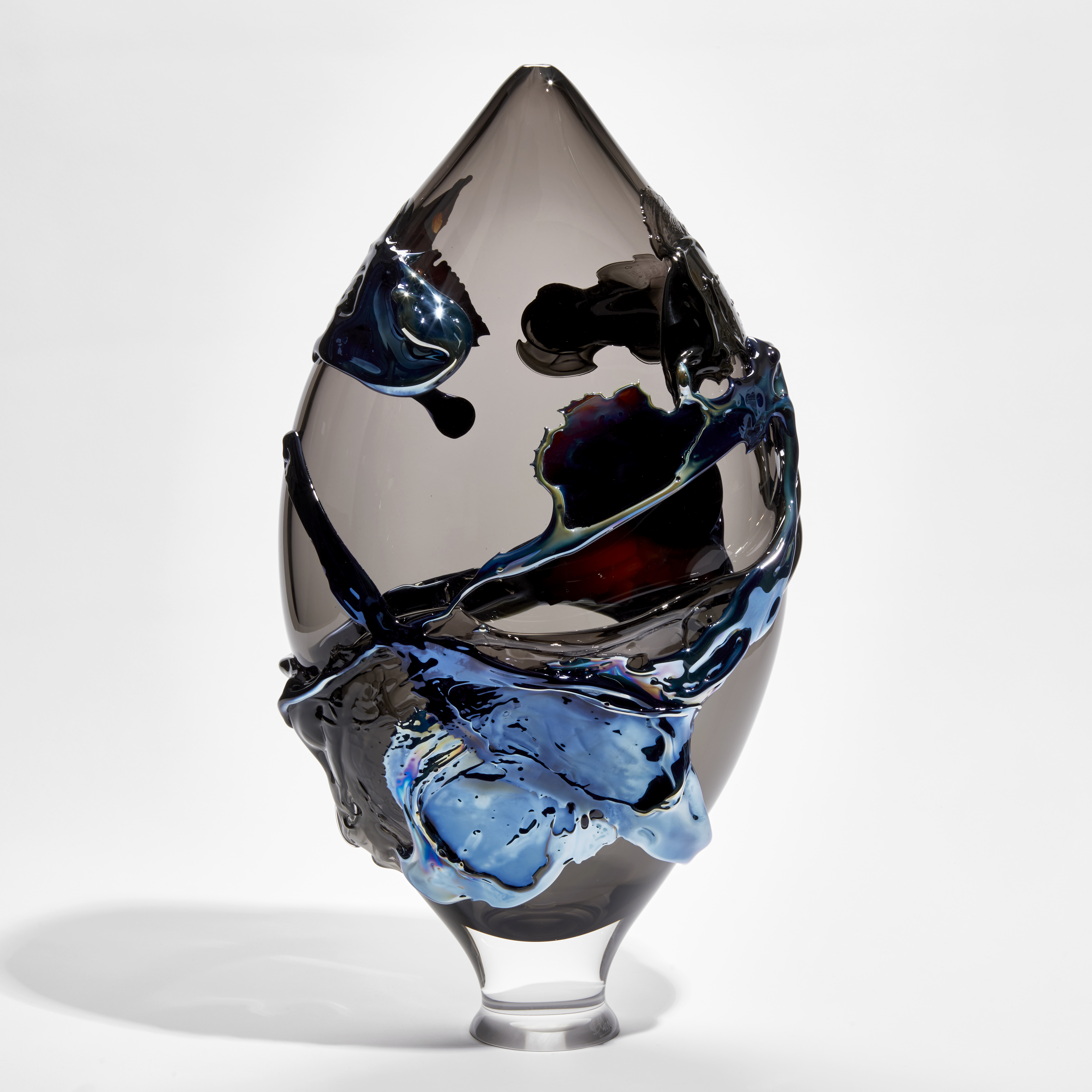 teardrop vessel in transparent smokey glass with lustrous organic surface decoration handmade from glass