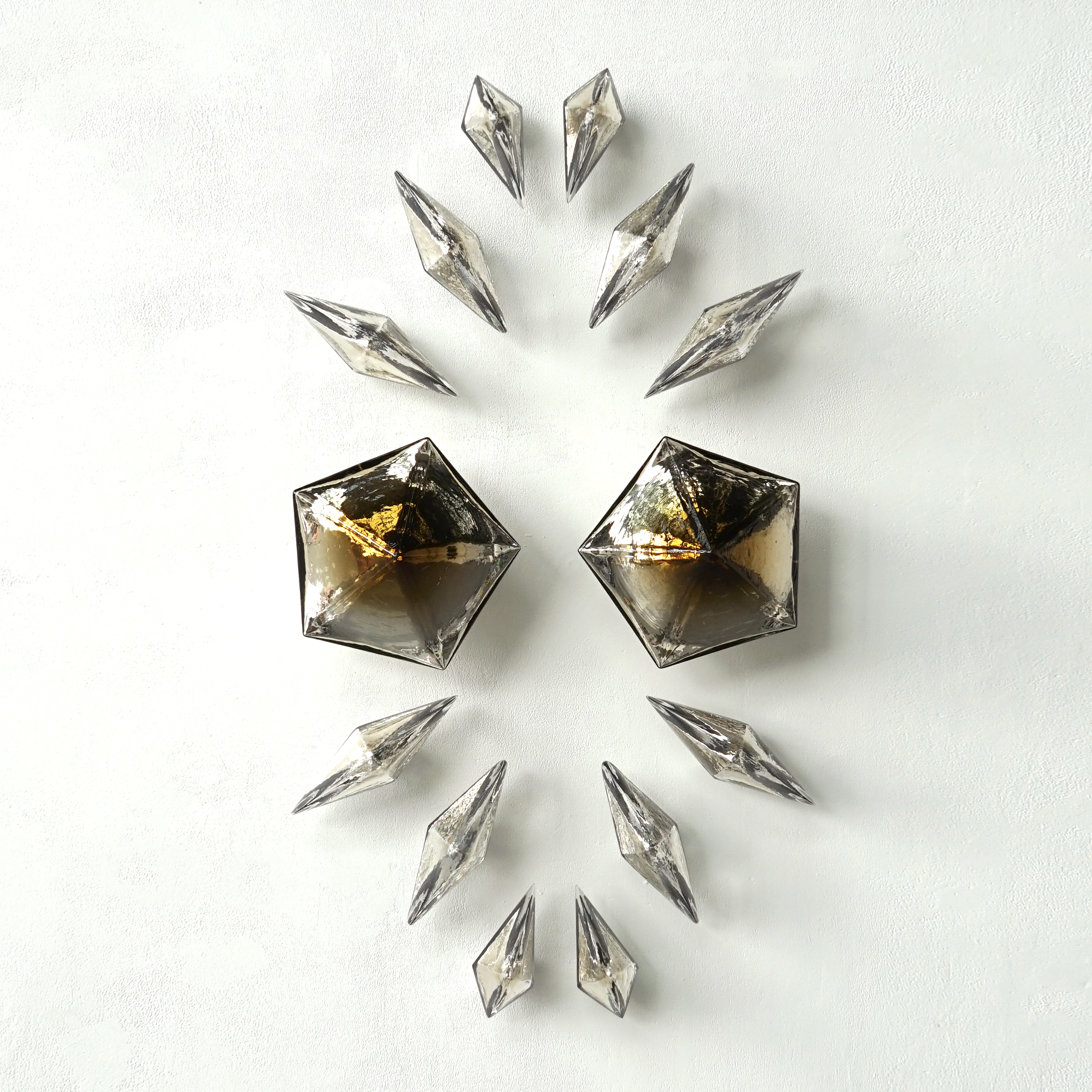 pentagons and diamond wall mounted formation in bronze glass with mirrored interior
