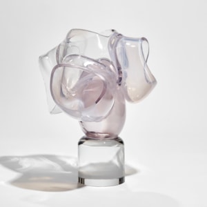 round clear base with soft pastel pink abstract floral explosion above hand made from glass