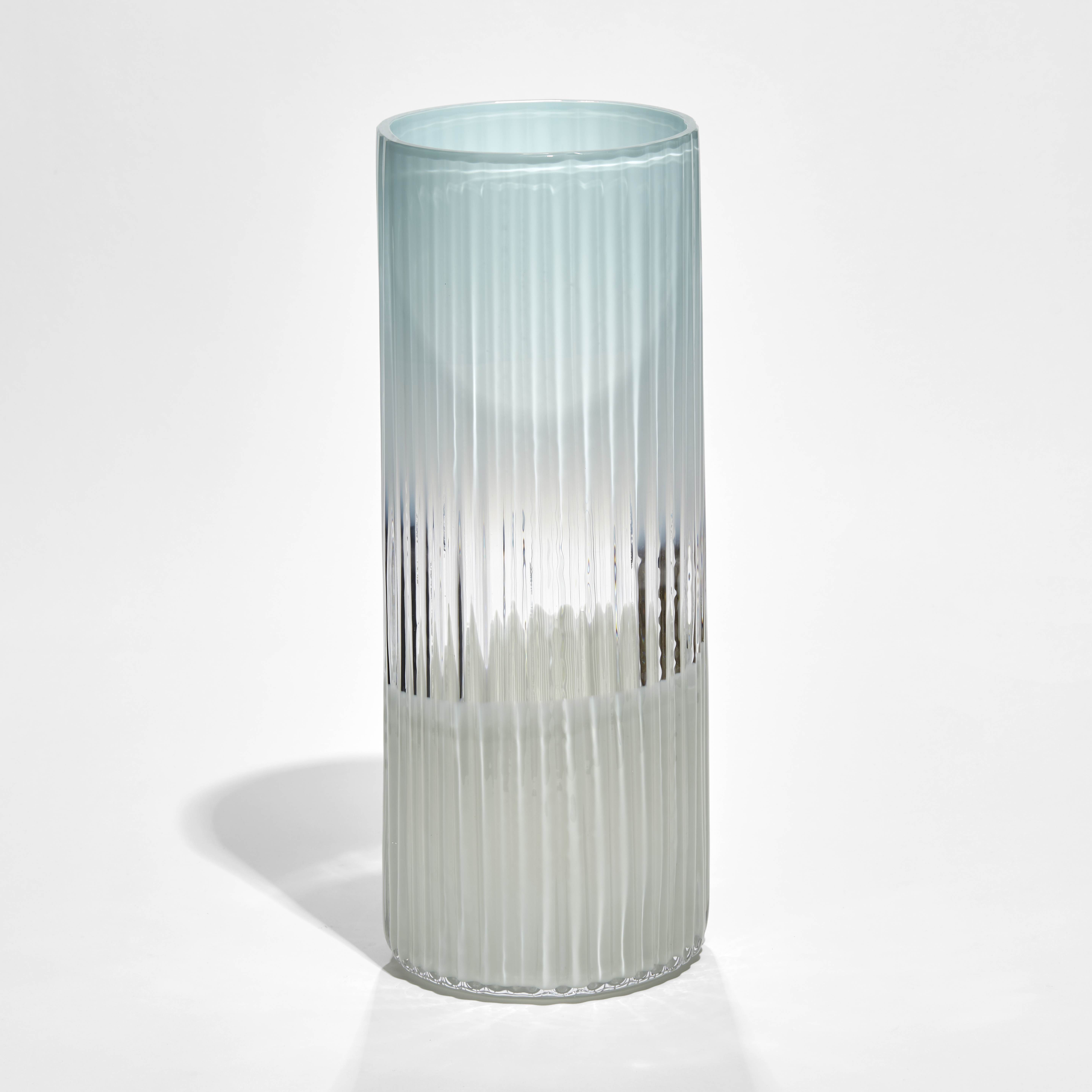 soft blue clear and celadon cylindrical ridged glass vase hand made from glass