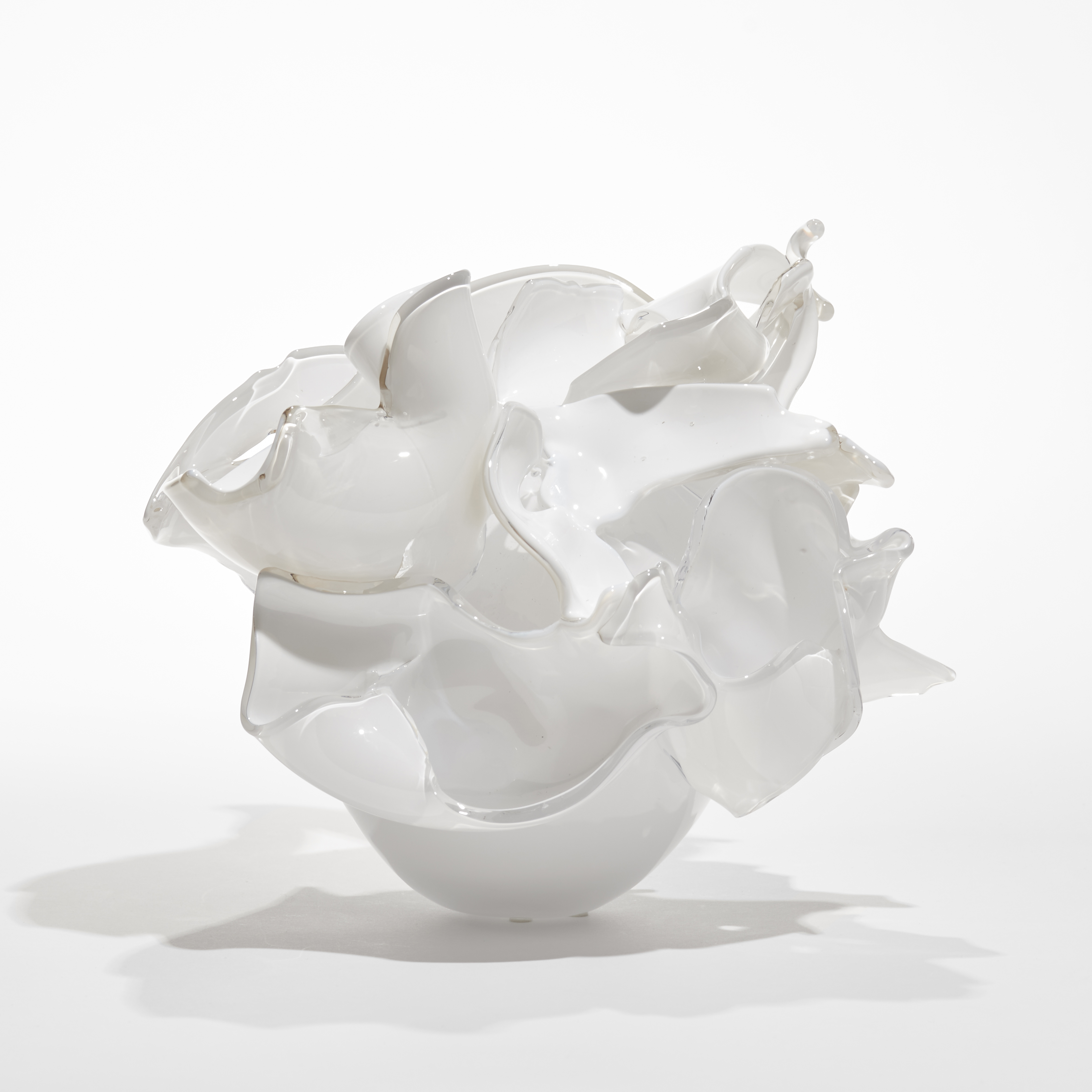 opaque white abstract floral sculpture with petals made from cut open bubbles hand made from glass