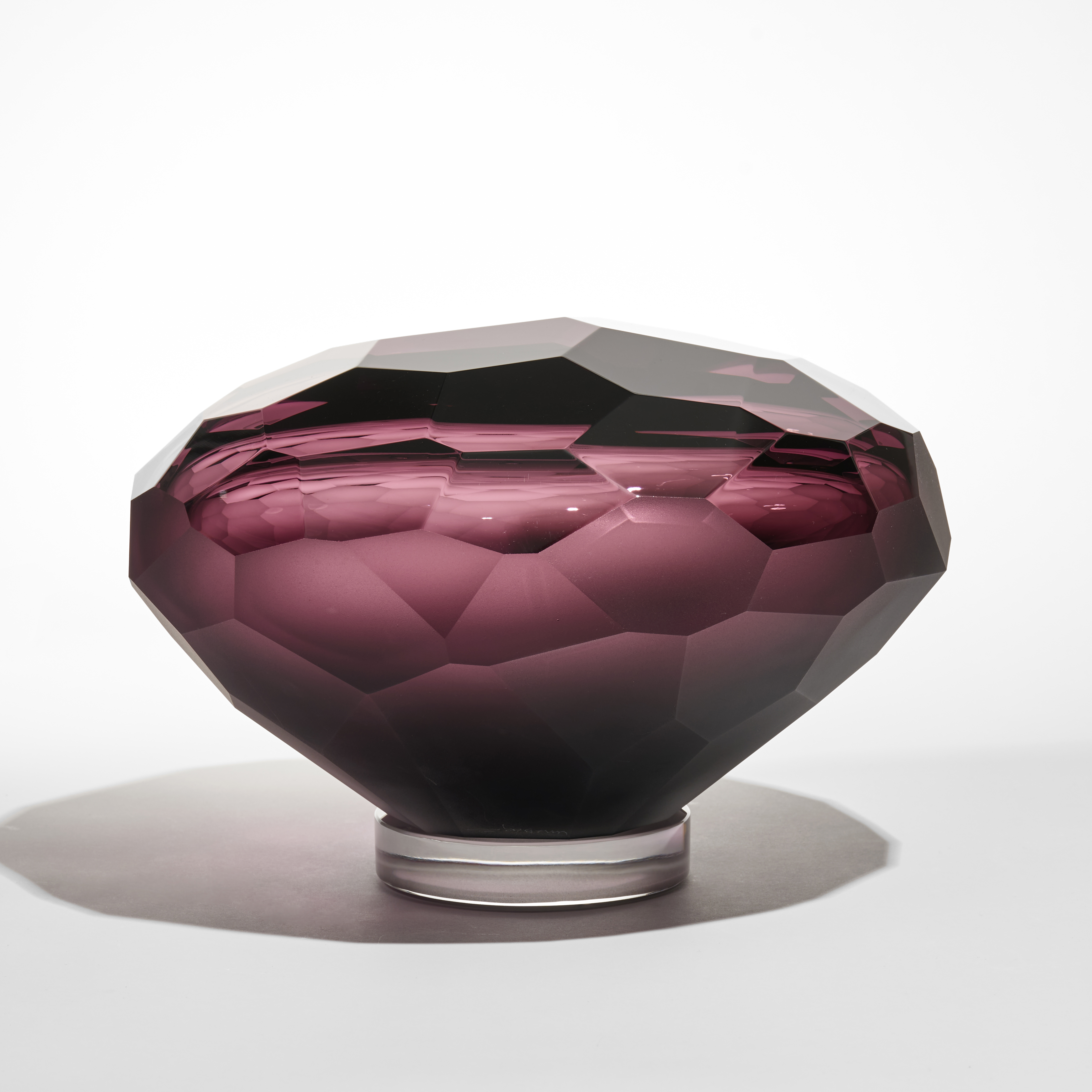 abstract mushroom shaped facetted sculpture in rich red purple hand made from glass