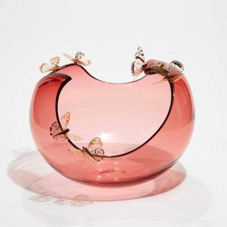 soft peach bubble bowl with meandering cut edge with six gold butterflies peached around on the rim hand made from blown glass and steel
