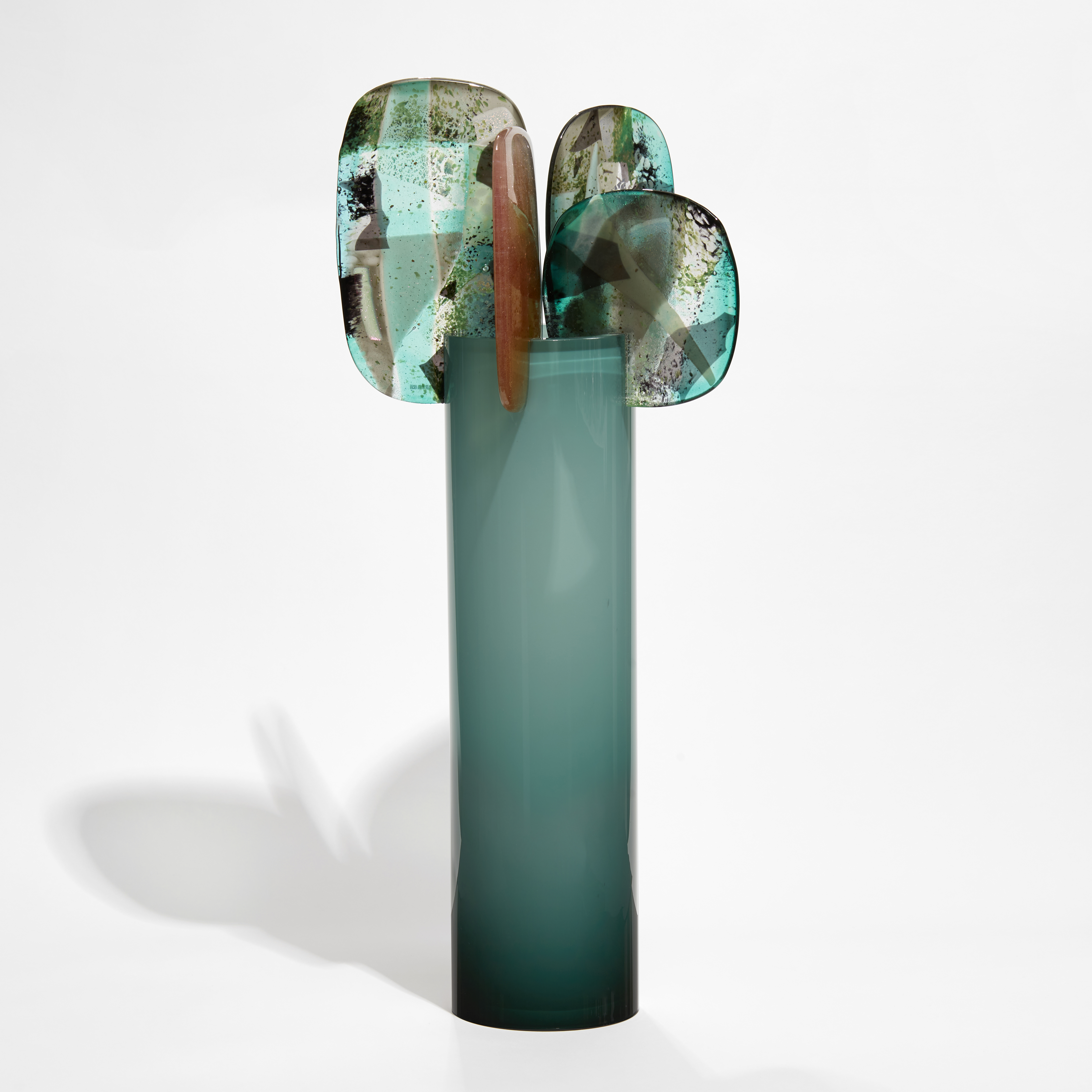 tall tube in fading from the top from light to dark green with 5 rounded finials in various colours balanced on the top hand made from glass