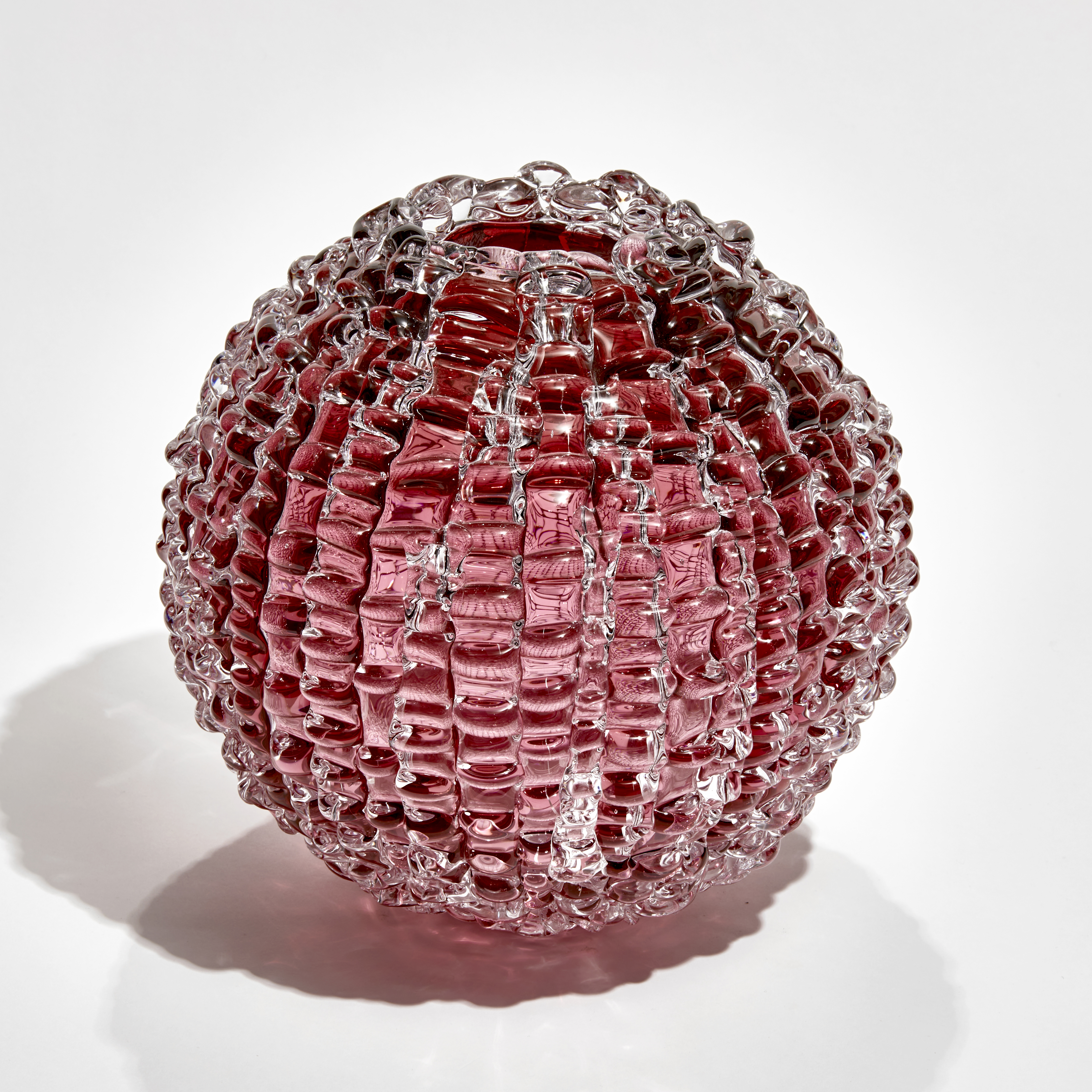 handblown spherical contemporary art glass sculpture in heliotrope arranged from small shards