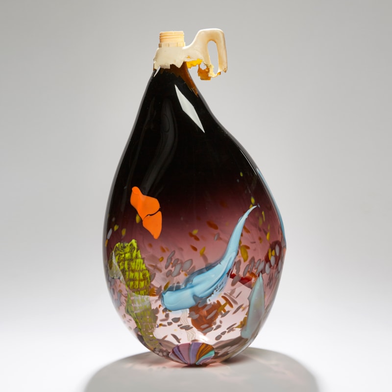 aubergine coloured soft teardrop shaped vessel with patches of bright orange blue and yellow hand made from glass with ocean plastic cap on top