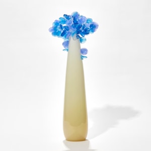 tall pop art hand made glass tree with alabaster coloured smooth trunk and candy coloured blue rounded mass of leaves on top