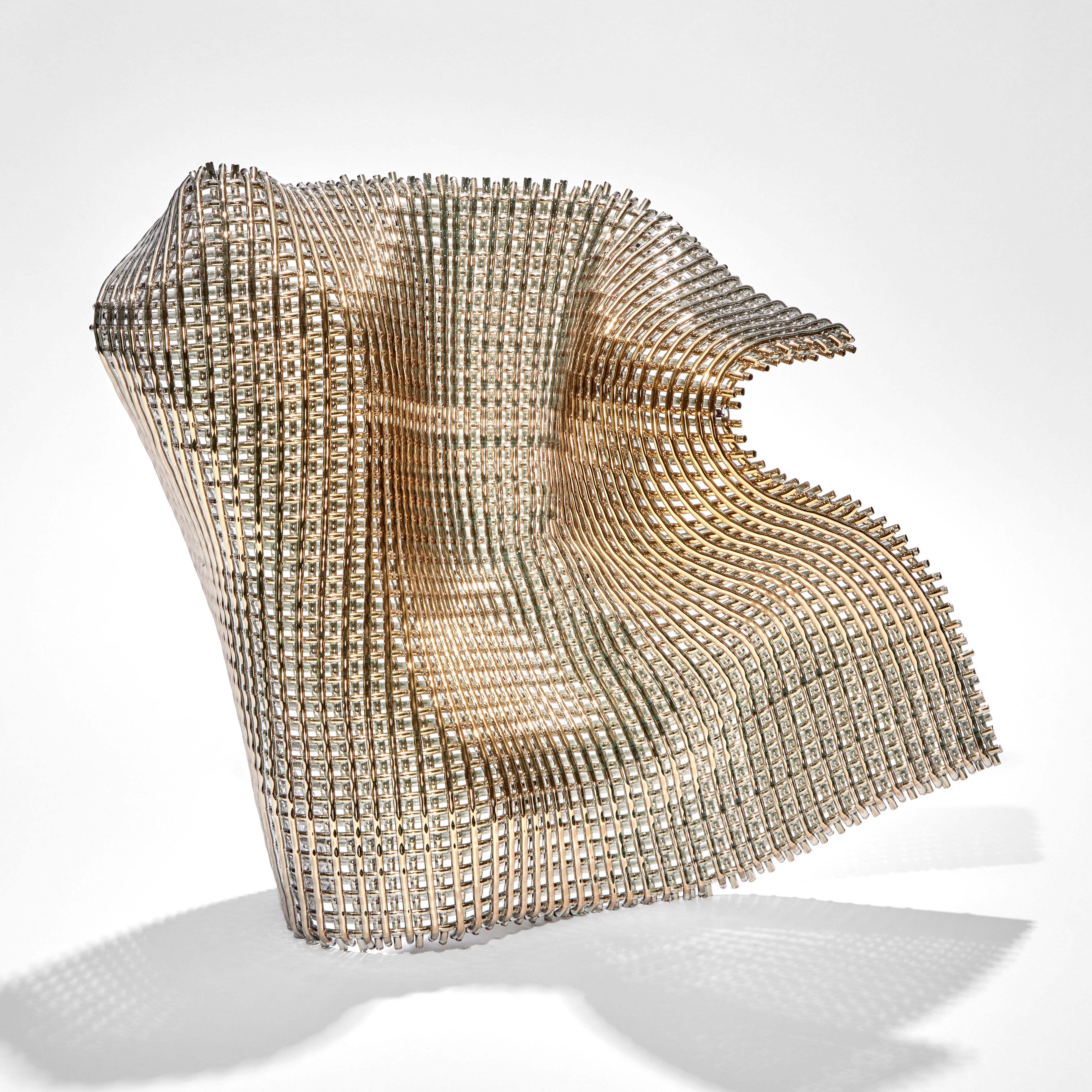 suspended and standing woven cloth of gold made of thick threads hand made from glass 