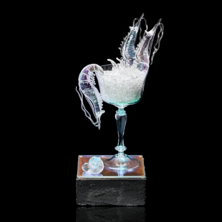 fancy goblet with crushed ice and two prawns with plinth below with prone prawn and sea shell hand made from clear glass