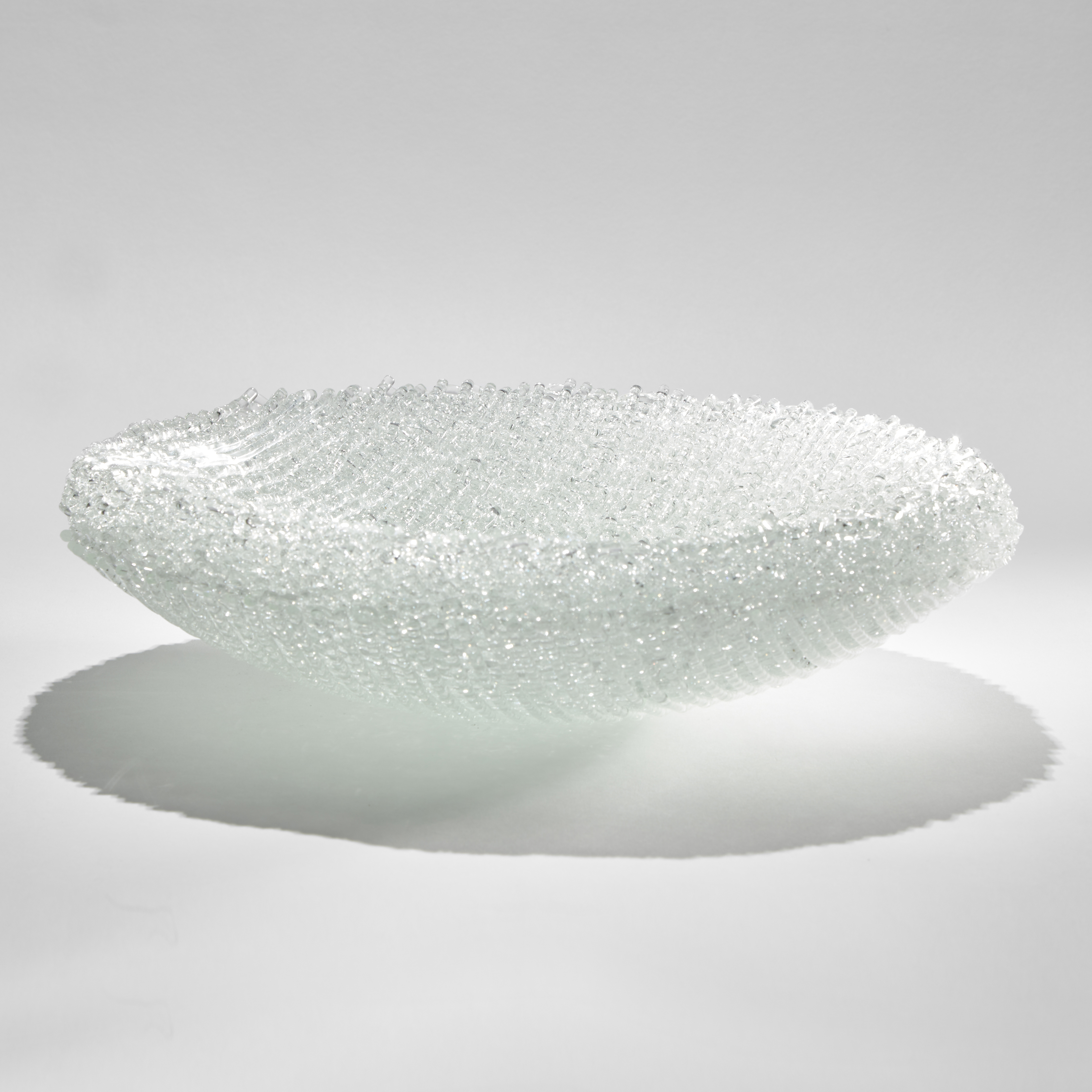 rounded base thick centrepiece bowl created from layers of woven clear glass canes
