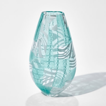 art glass vase in turquoise and white with modern line patterns