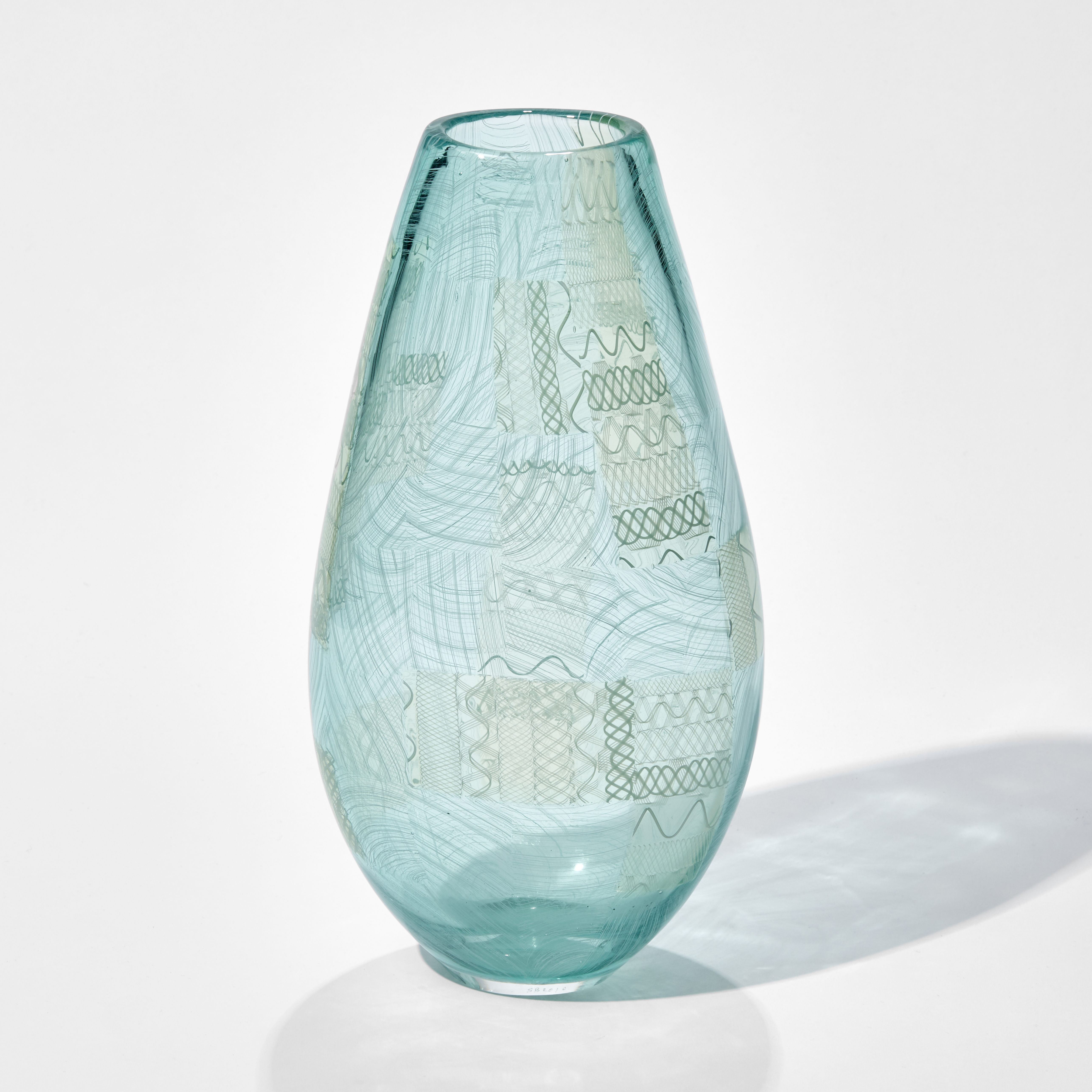 light blue art glass vase with faint green tint and faint lined pattern