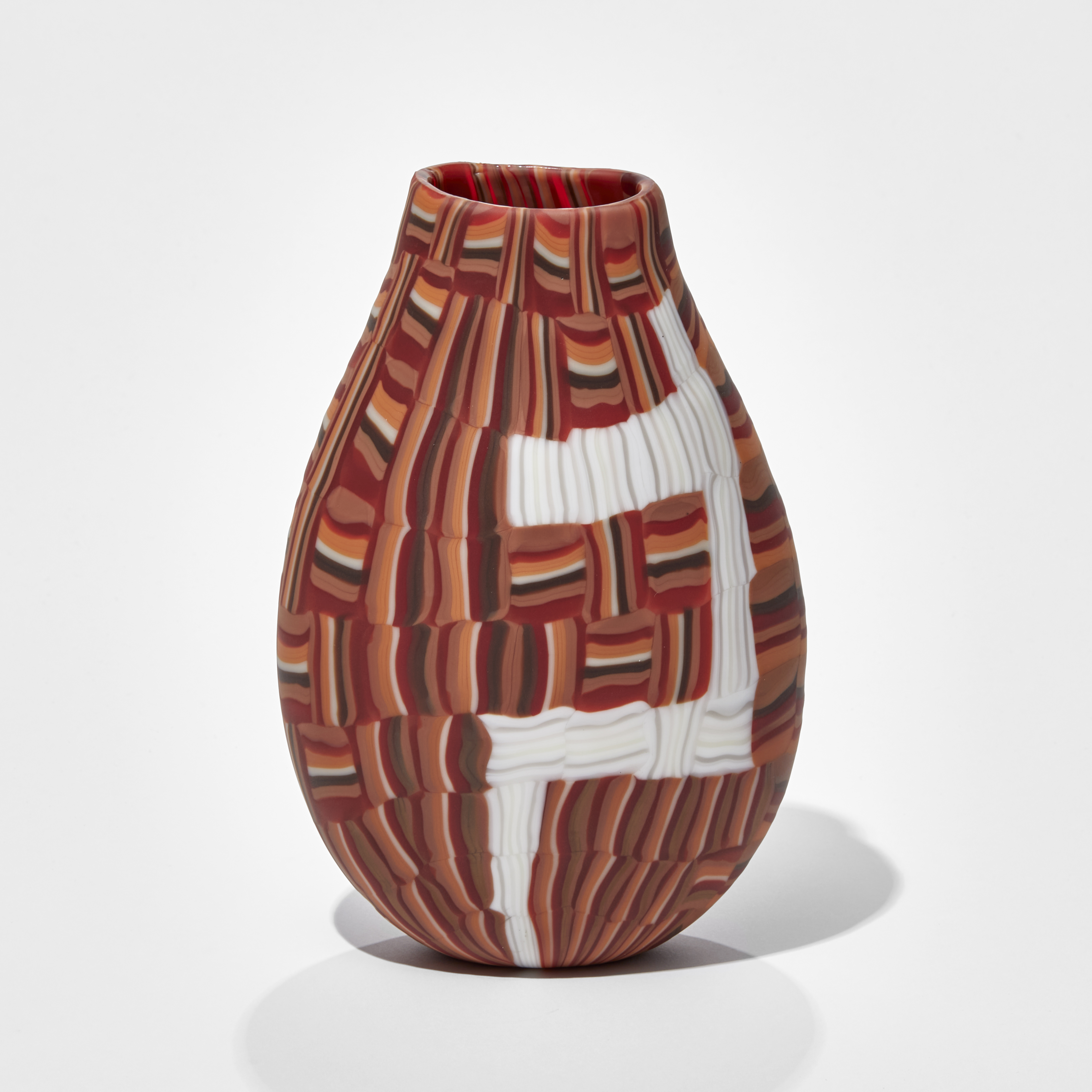 teardrop shaped vase with abstract mosaic block pattern in red orange black and white hand made from glass