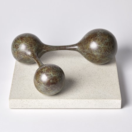 bronze minimalist sculpture of connected spheres on limestone base