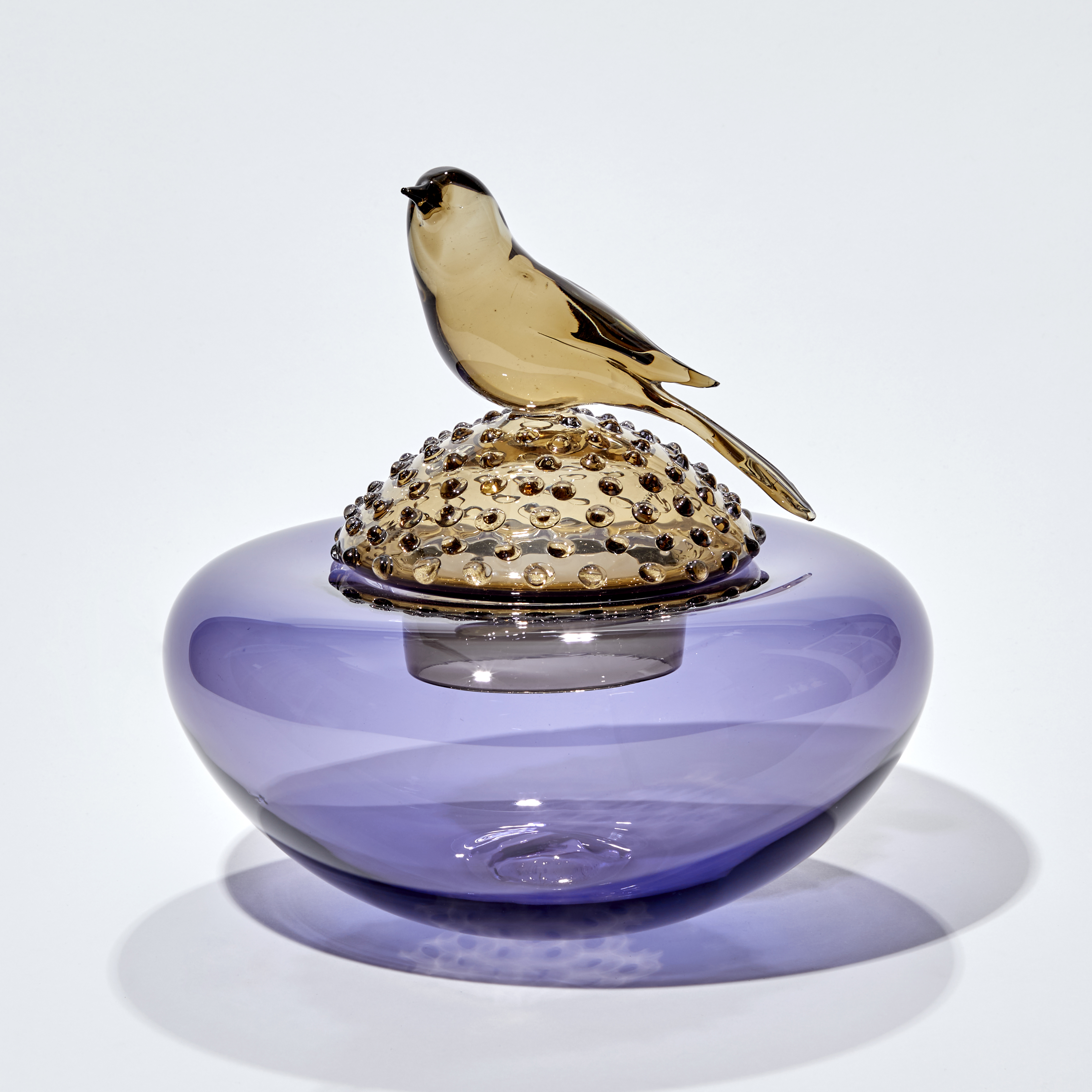 purple and bronze low centrepiece with lid covered in raised dots and perched bronze bird hand made from glass