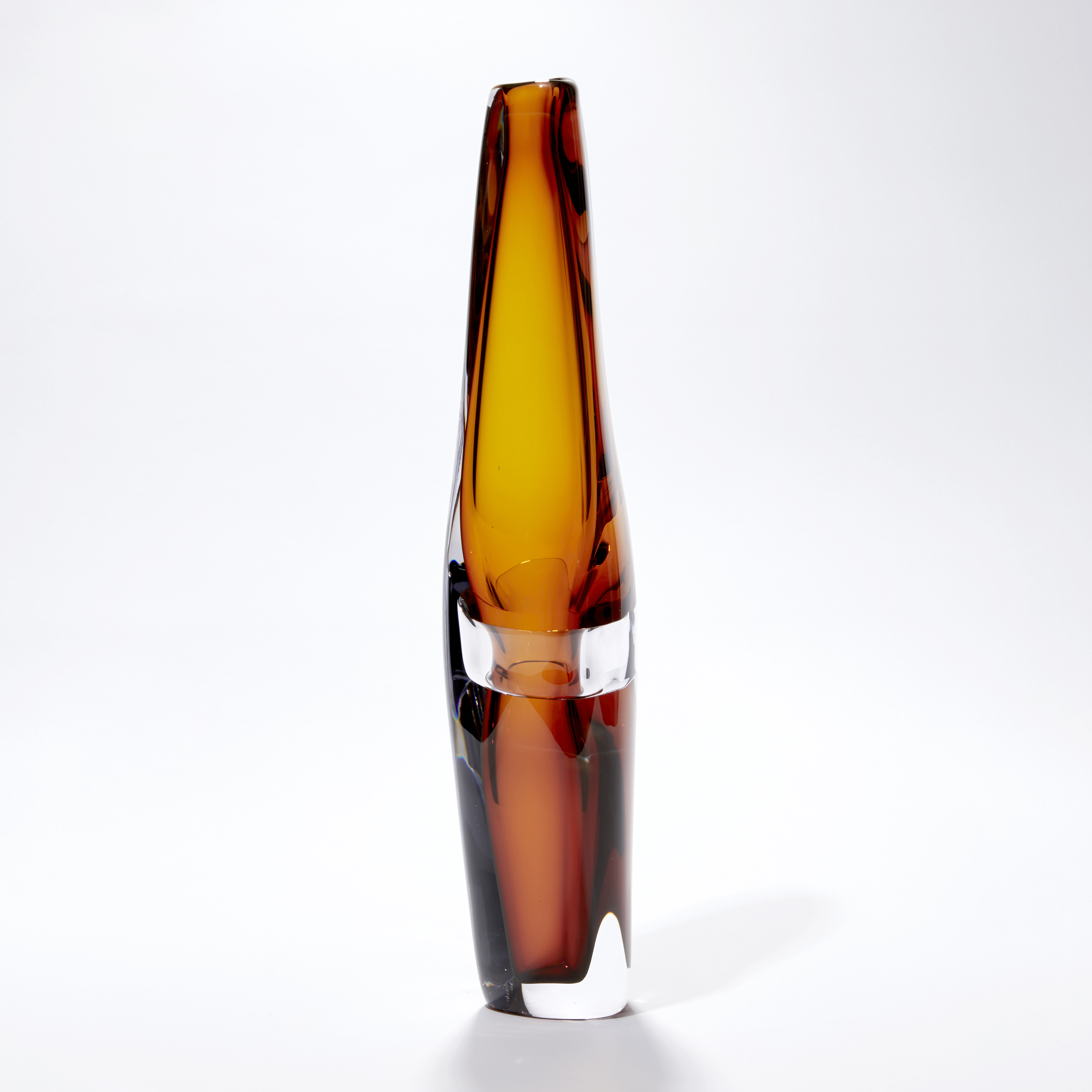 tall slender and organic in form transparent amber vase with clear middle band hand blown from glass