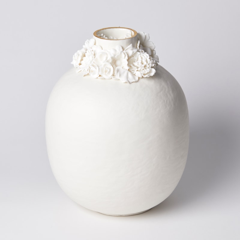 rounded jar with slightly uneven surface and floral ring around the opening with gold lustre band hand made from porcelain and parian
