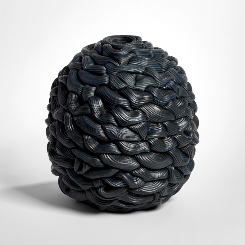 rounded woven black ridged vessel hand made from parian porcelain with small top opening
