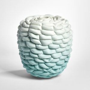 teal aqua fading to off white chunky woven and ridged vessel in a flat topped barrel shape hand made from parian porcelain