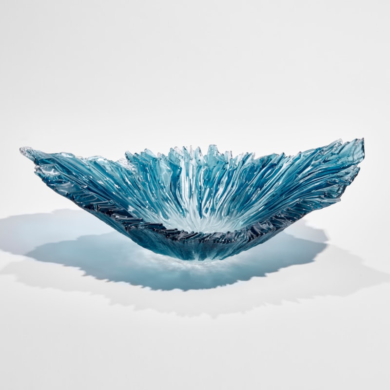 aqua blue and ice blue oval ridged sculptural bowl with raised ends and rippled interior hand made from glass
