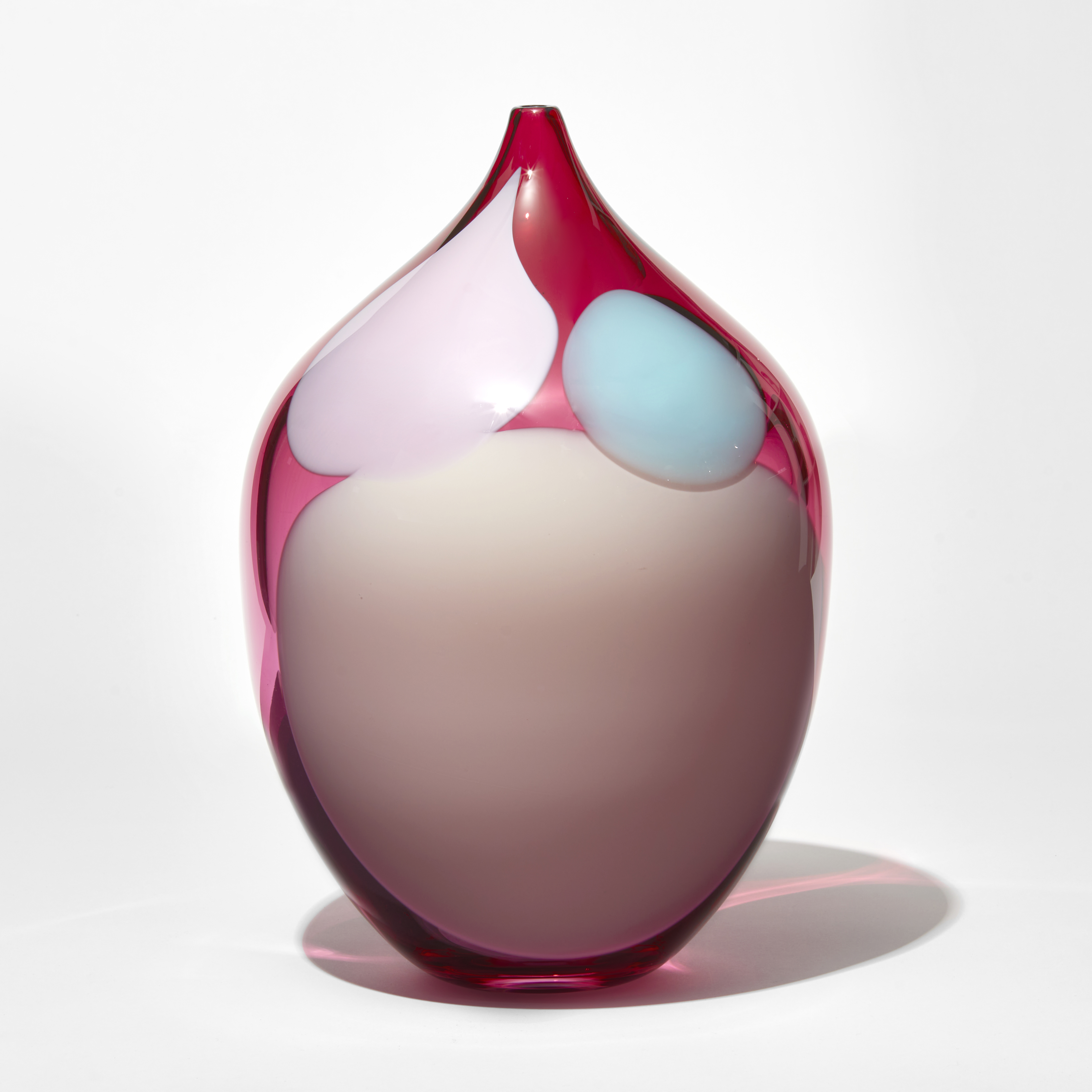transparent rich ruby pink rounded jar with narrow neck with small opening with abstract amorphous blobs in opaque baby pink blue and soft pink hand made from glass