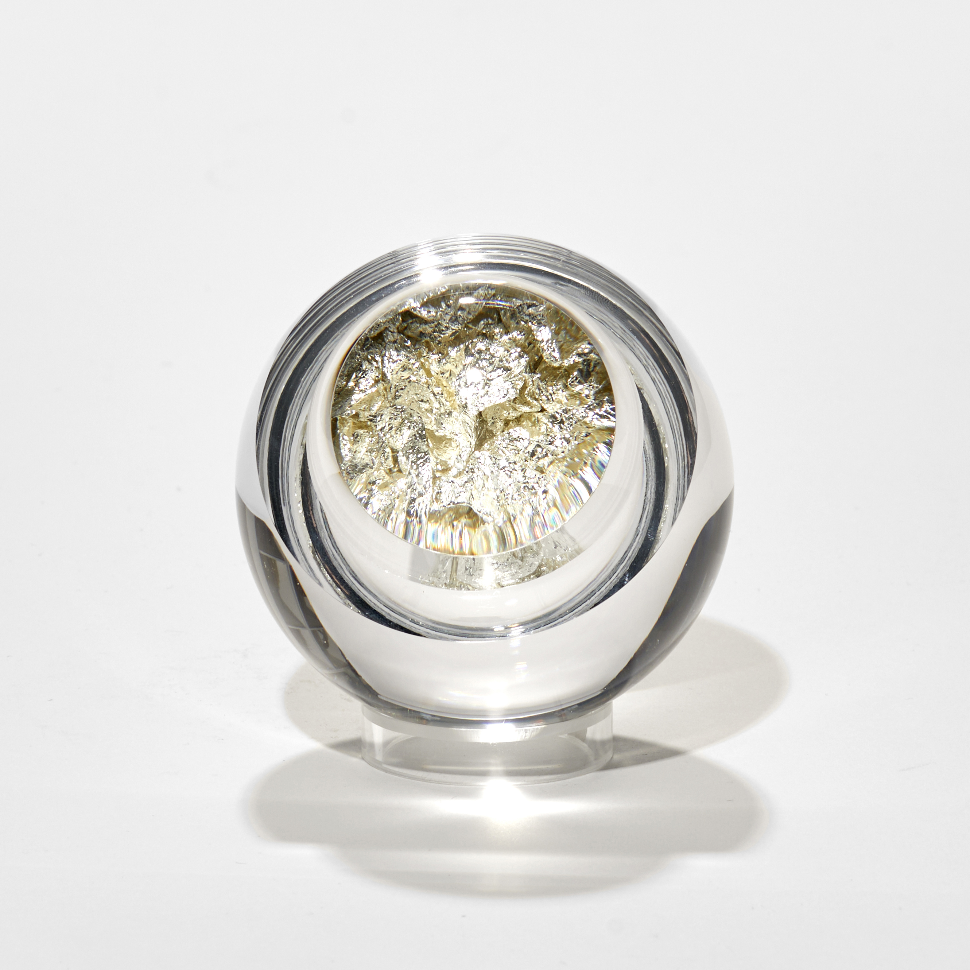round glass ball with hollow centre will with crunched up white gold leaf with fixed magnifying lens lid hand made from glass