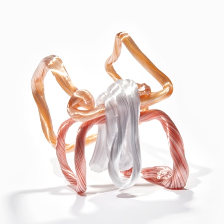 twisted looping candy cane standing angular structure constructed from ridged canes in white pink and coral orange hand made from glass