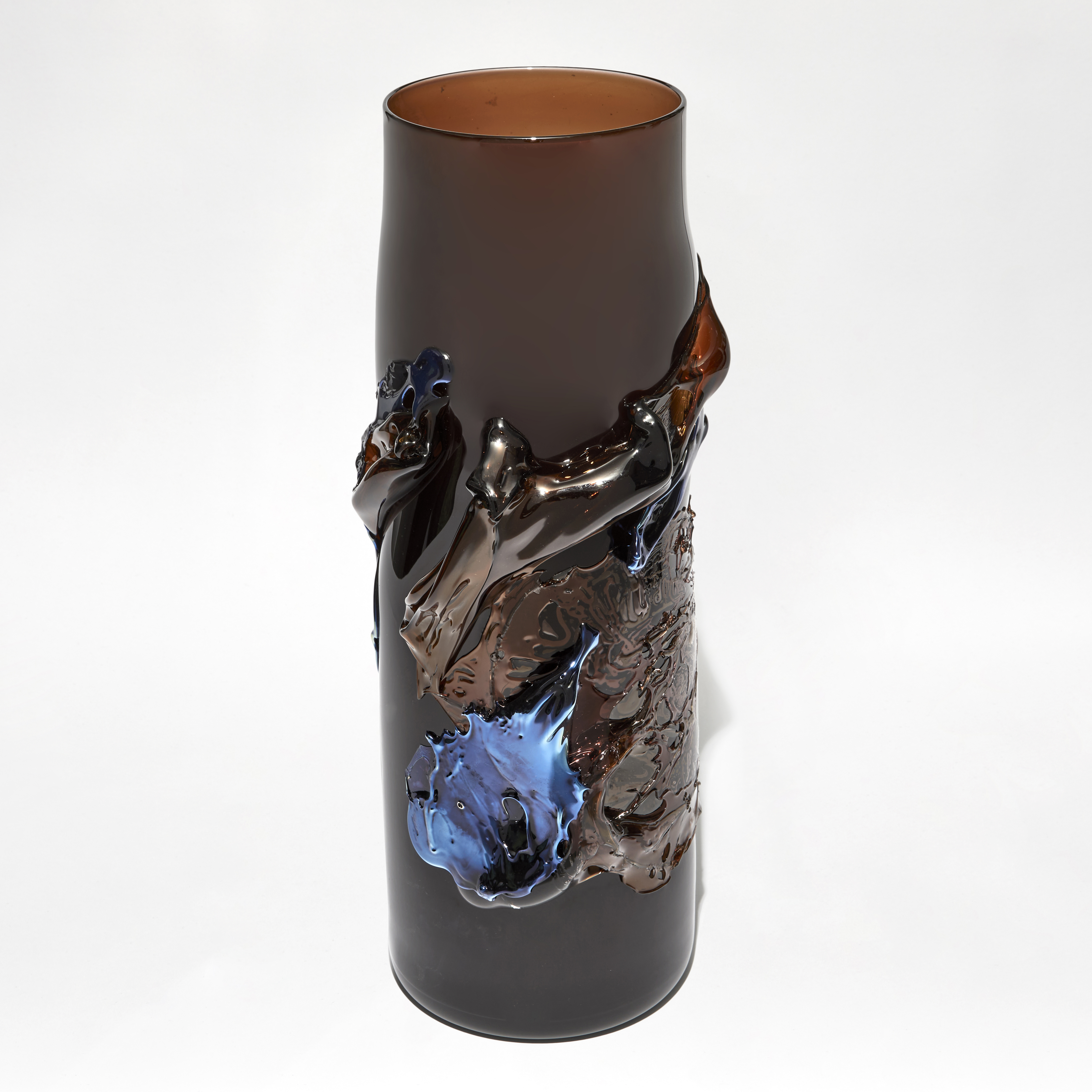 rich dark transparent amber brown vase with tapering neck with raised organic textured detail in metallic blue and brown handblown from glass
