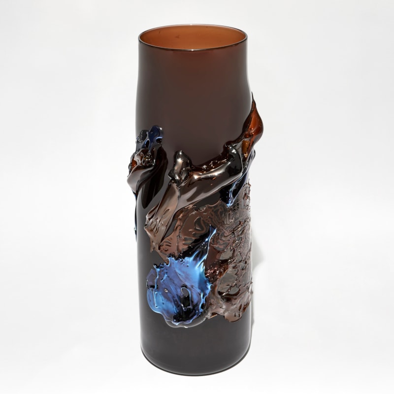 rich dark transparent amber brown vase with tapering neck with raised organic textured detail in metallic blue and brown handblown from glass