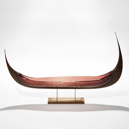 viking ship with oak keel with carved detail and aubergine tea coloured glass hull with cut texture raised on a simple two steel pinned base in wood hand made