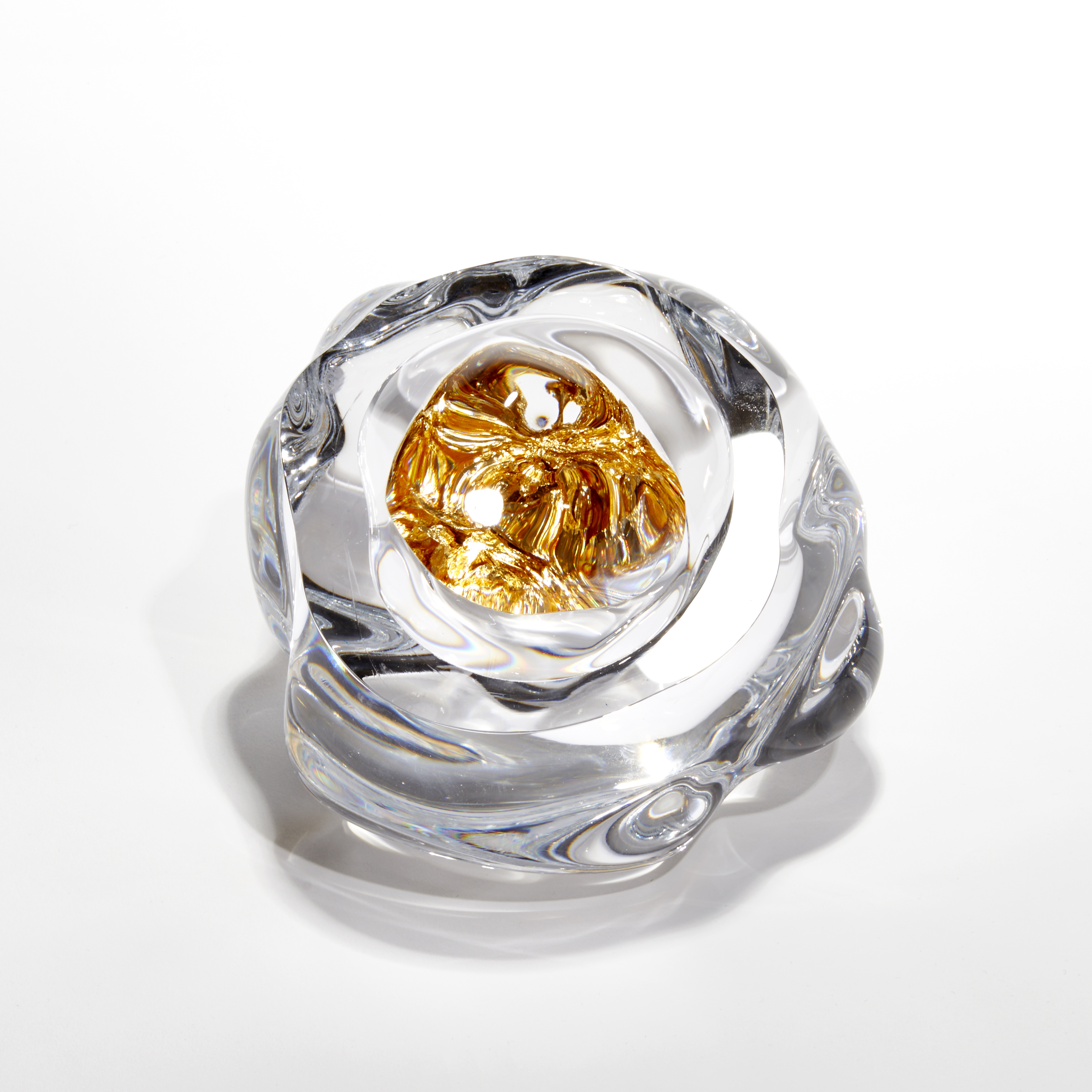 amorphous clear boulder with centre filled with gold leaf hand blown and sculpted from glass