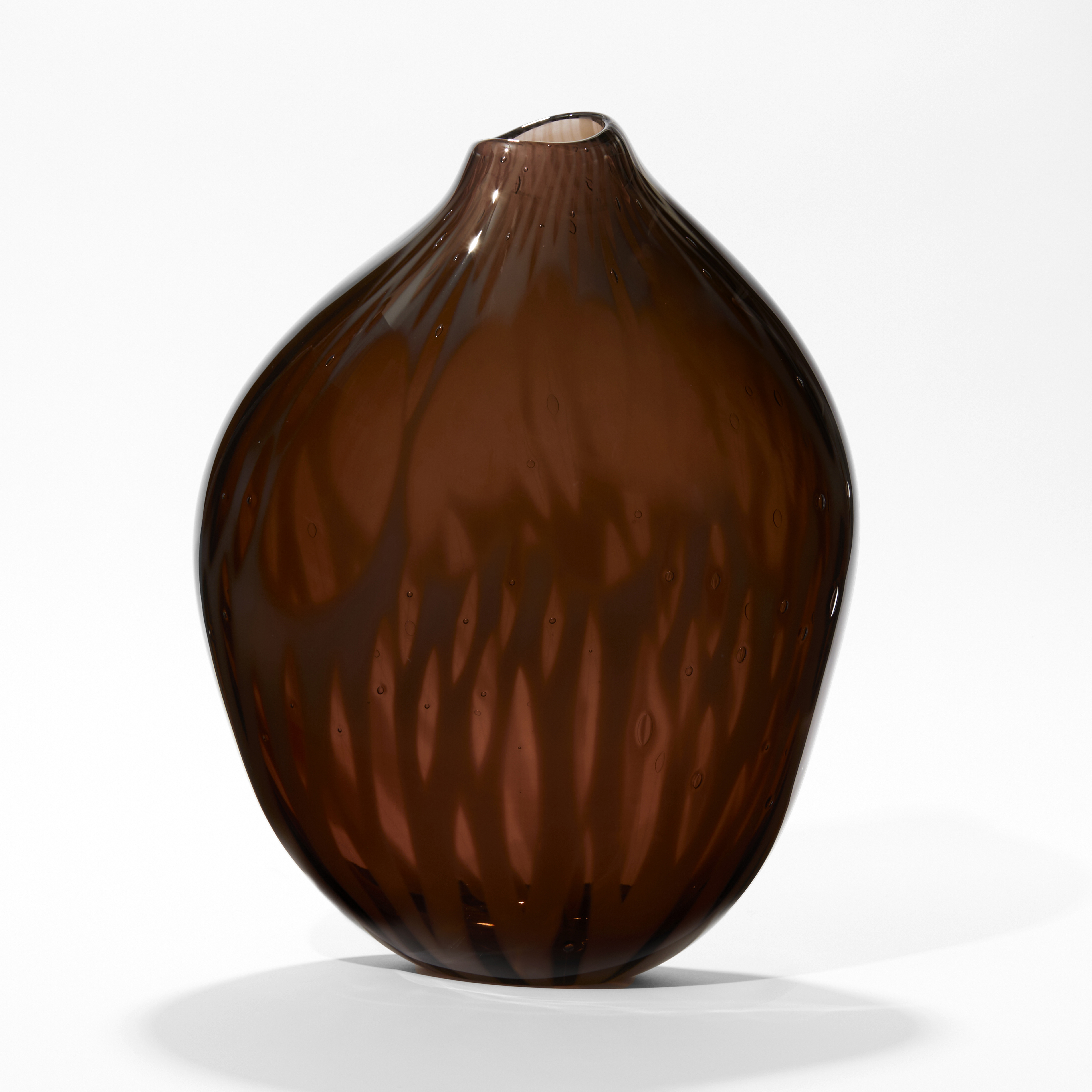 rich dark plum coloured vessel with subtle organic surface texture with amorphic shape and offset top opening hand made from glass