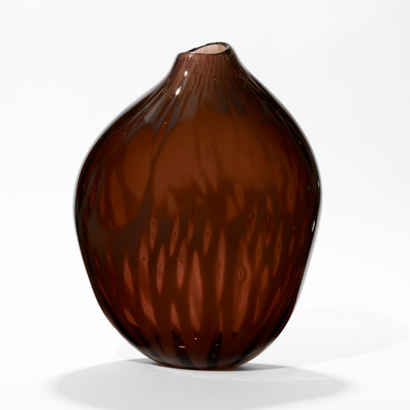 rich dark plum coloured vessel with subtle organic surface texture with amorphic shape and offset top opening hand made from glass