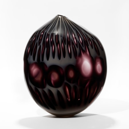 asymmetric dark purple and milky grey hand blown glass vessel resembling an abstract poppy seed head
