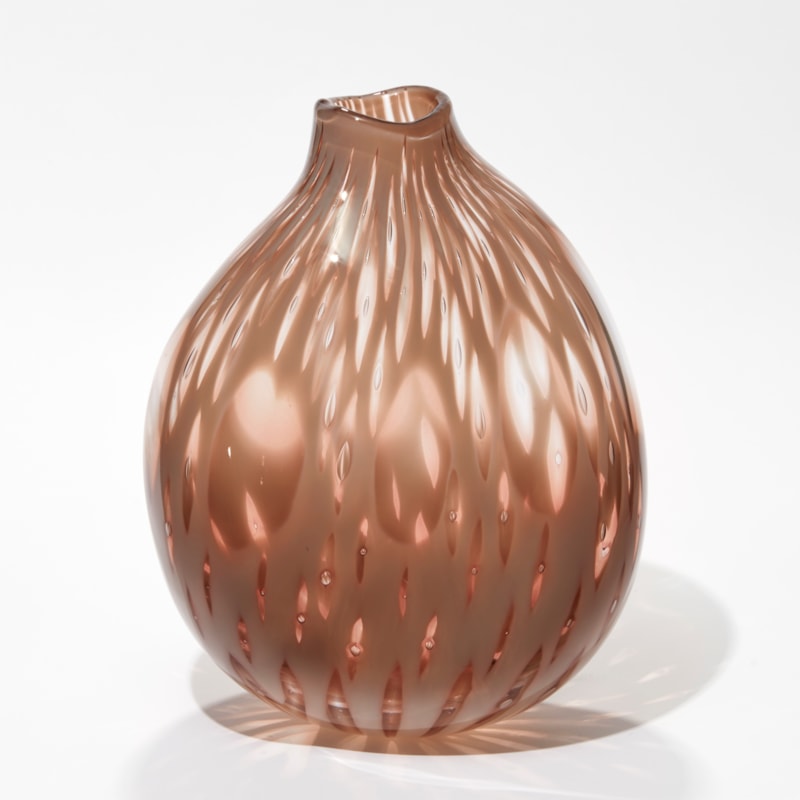 abstract poppy seed head inspired vase in soft pink with feathery surface pattern with see through sections hand made from glass