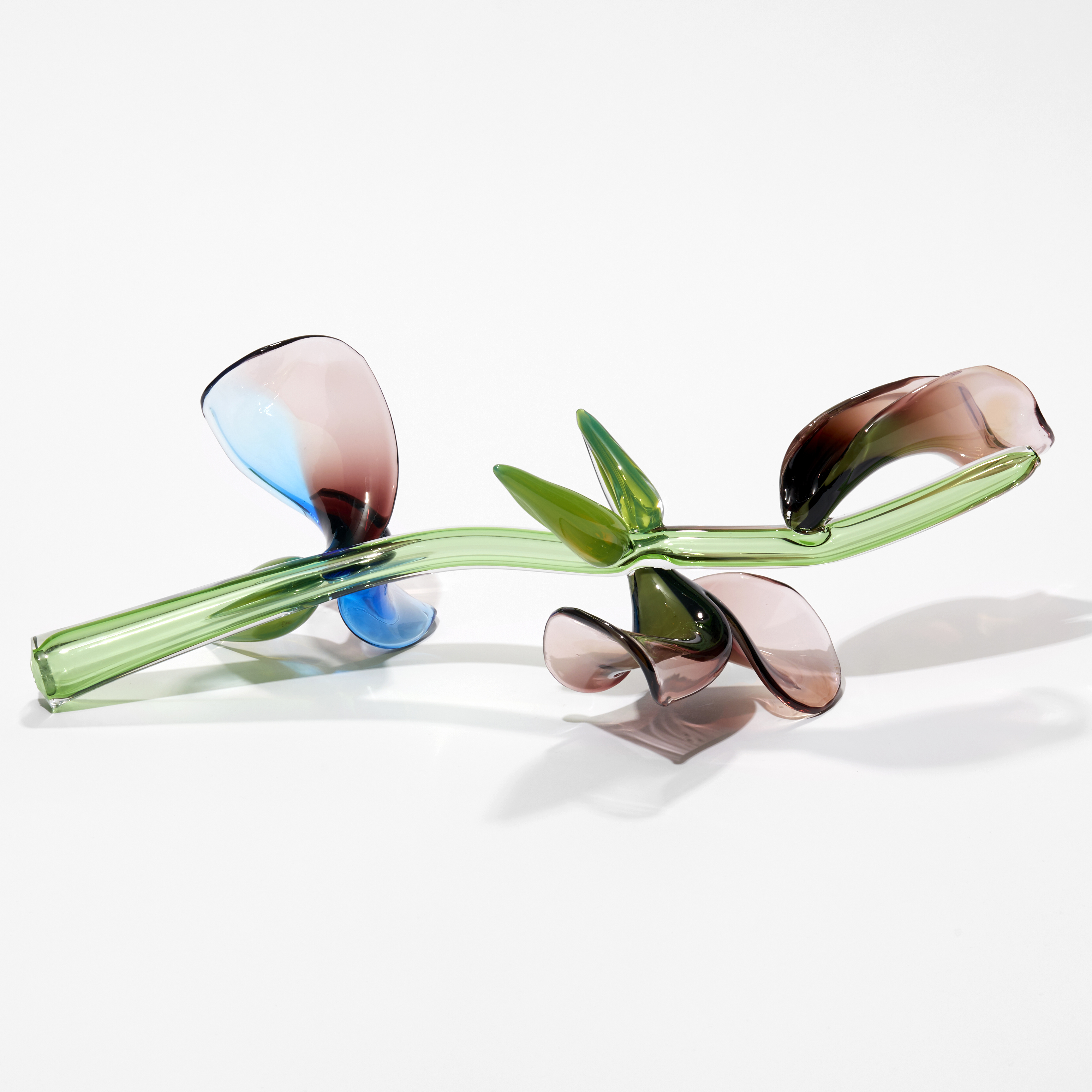 prone stem with abstract flowers and leaves in green pink aubergine and blue hand sculpted from blown glass