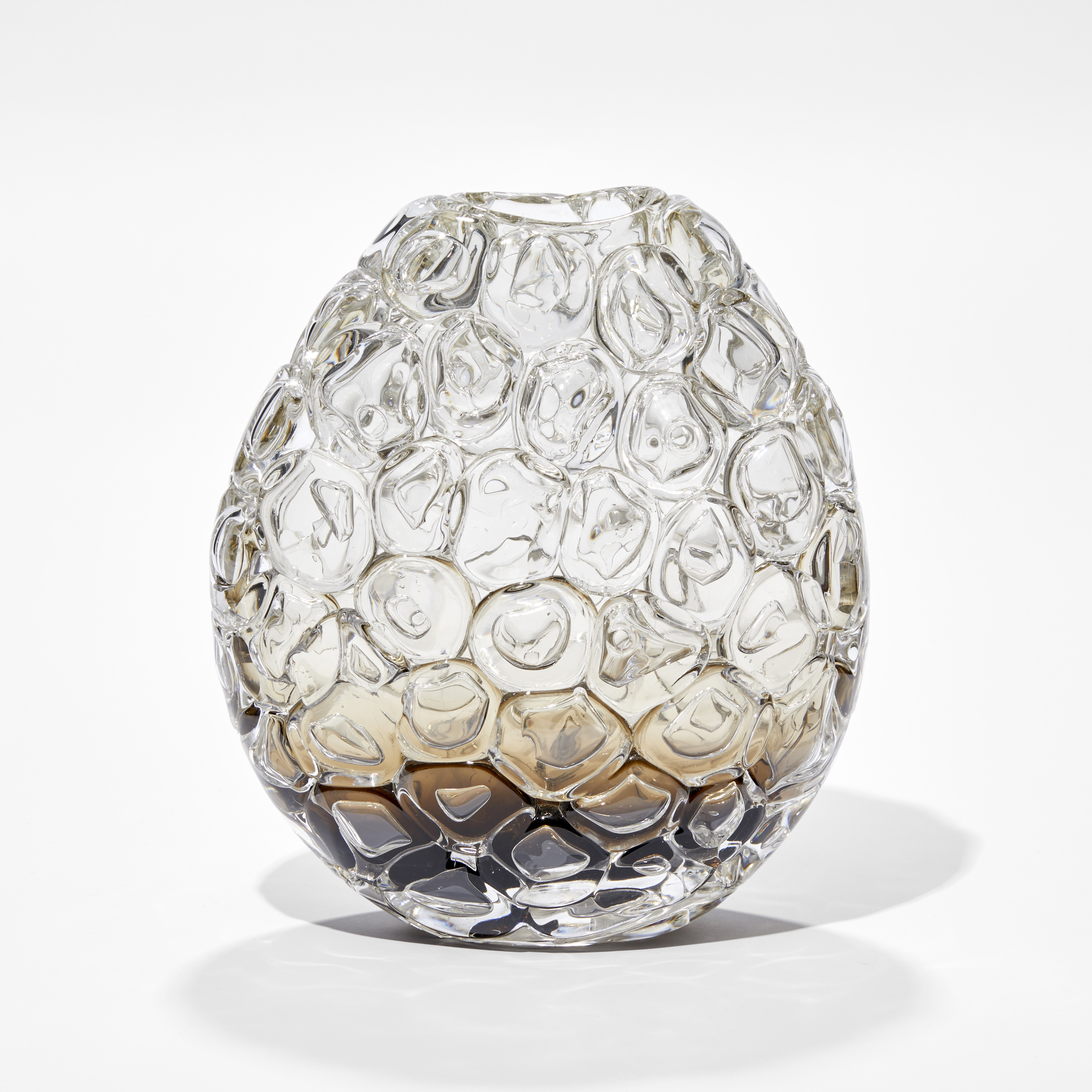 oval hand blown glass vase in clear fading to rich fawn brown at the very base covered in oversized bubbles