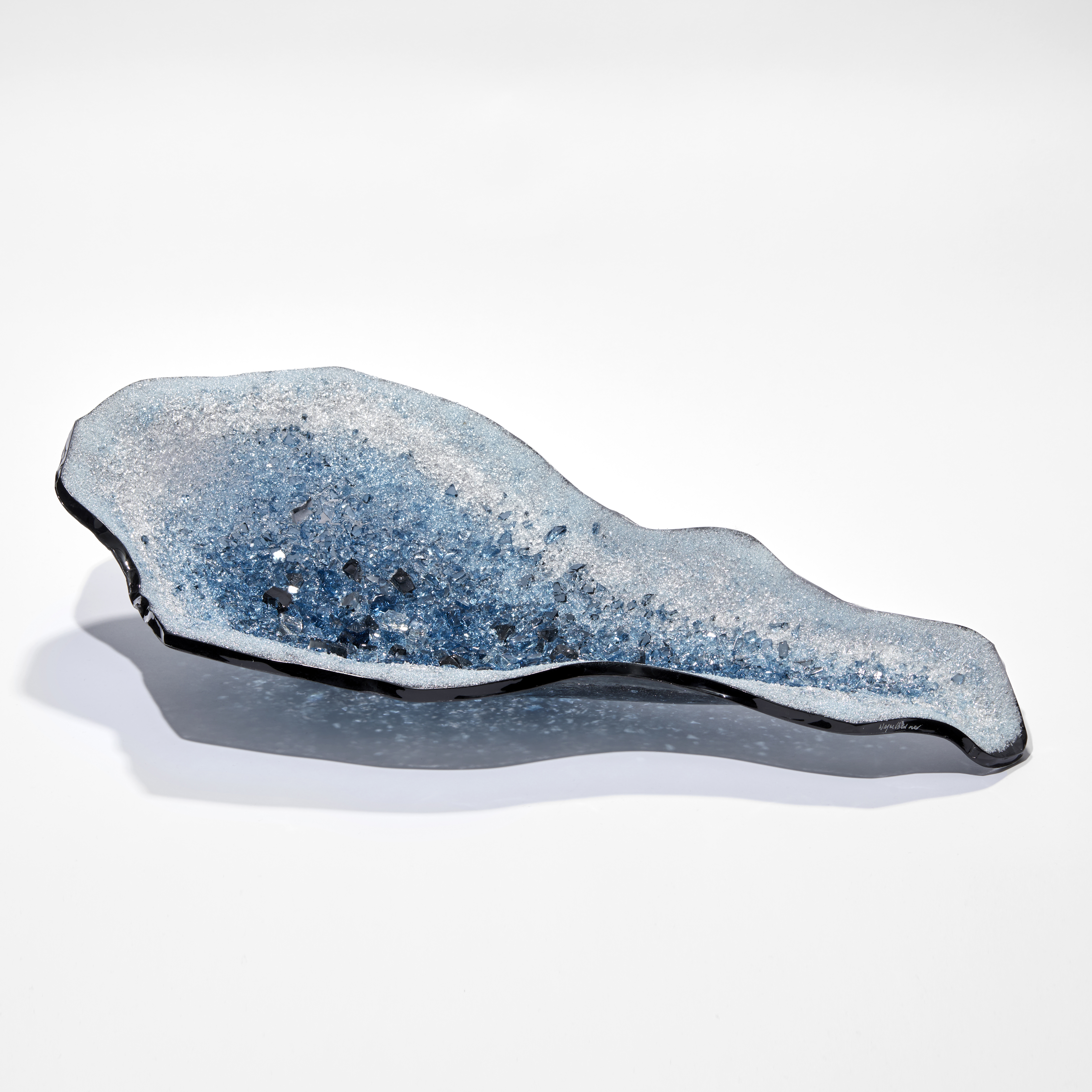 abstract oyster shell shaped sculptural platter filled with fine crystals in light grey turquoise and blue hand made from glass