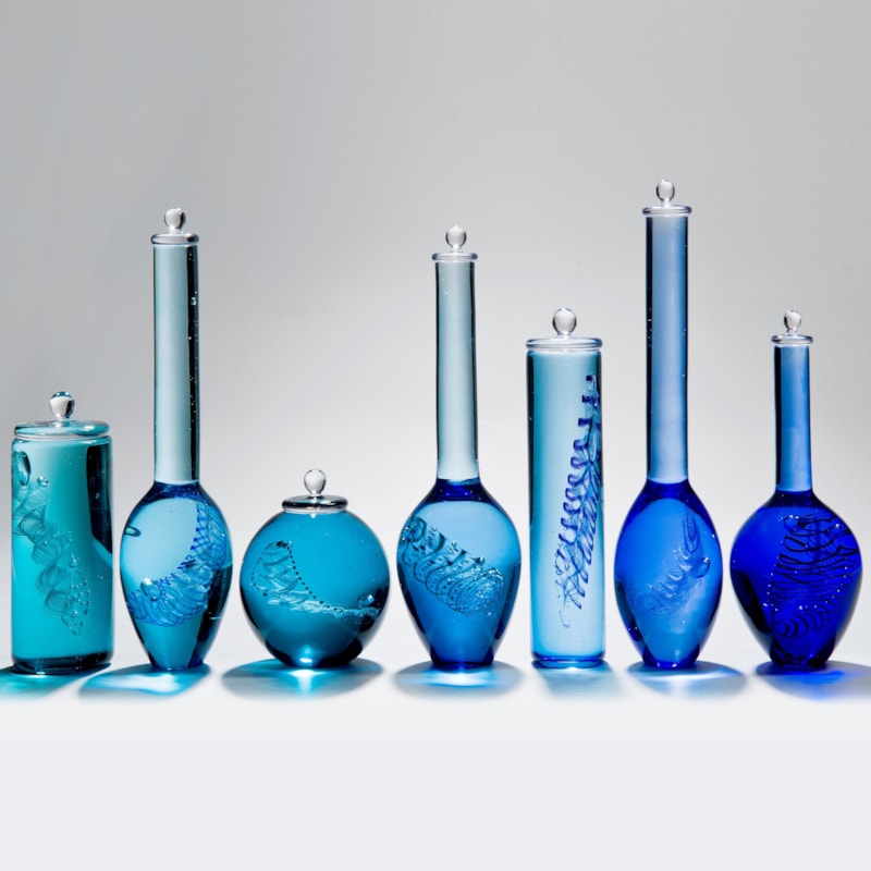 multicoloured scientific bottles installation created from handblown glass