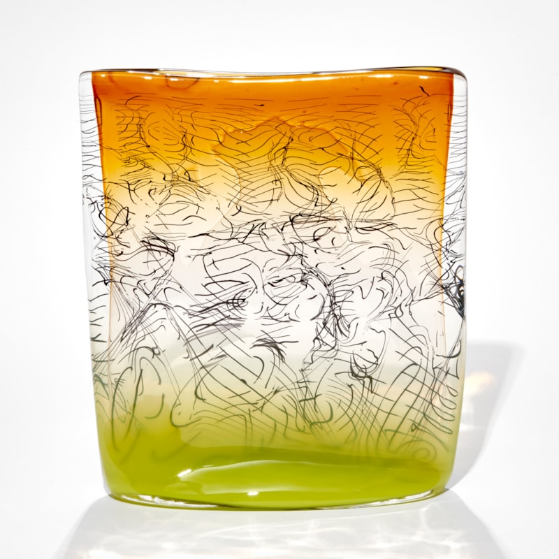 square sculpture with lime base fading to clear then ochre amber yellow with trapped black lines hand made from glass